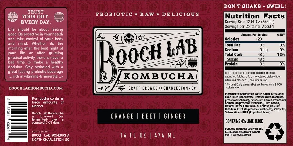 Label for Rooch Lab Kombucha, a probiotic beverage, with nutritional info, ingredients, and branding mentioning flavors orange, beet, ginger, brewed in Charleston, South Carolina.
