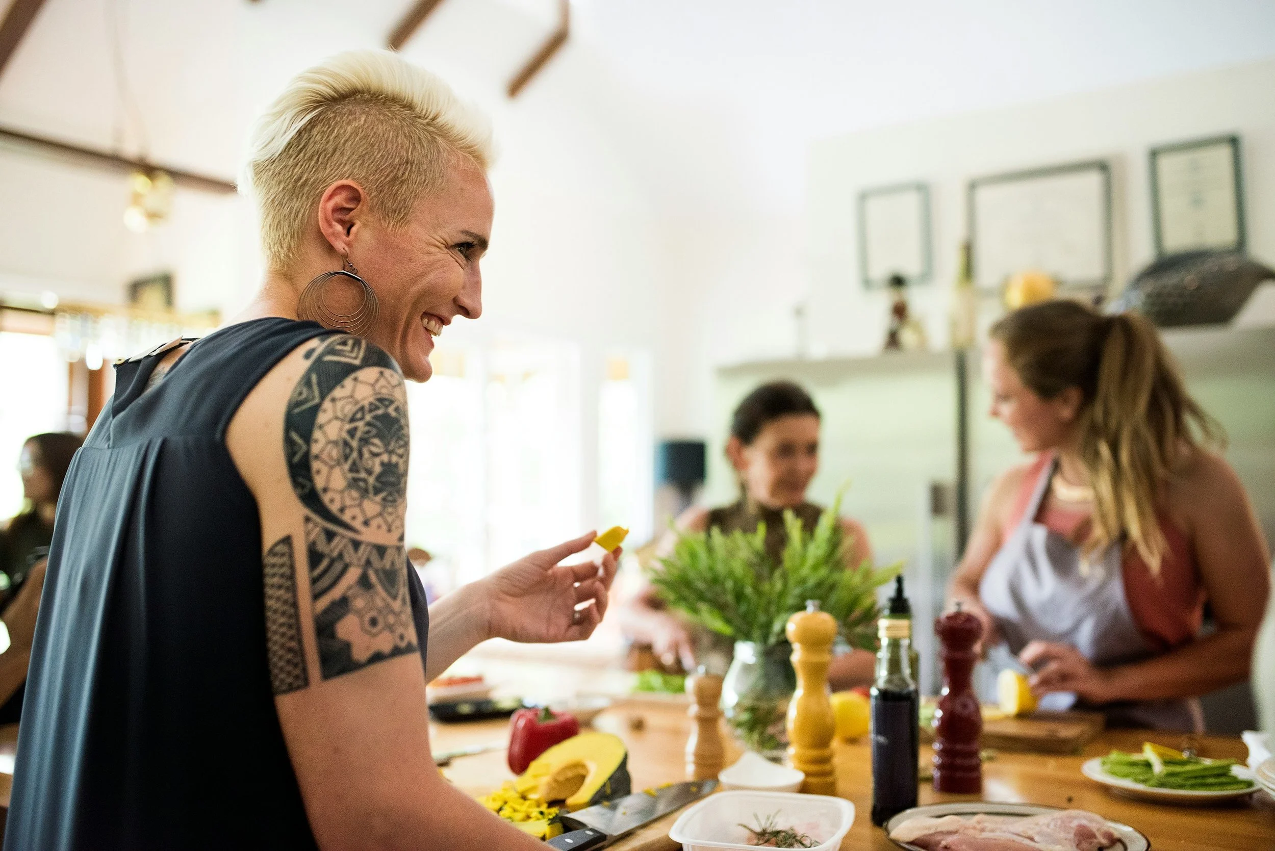 Two adults preparing a meal together in a kitchen.