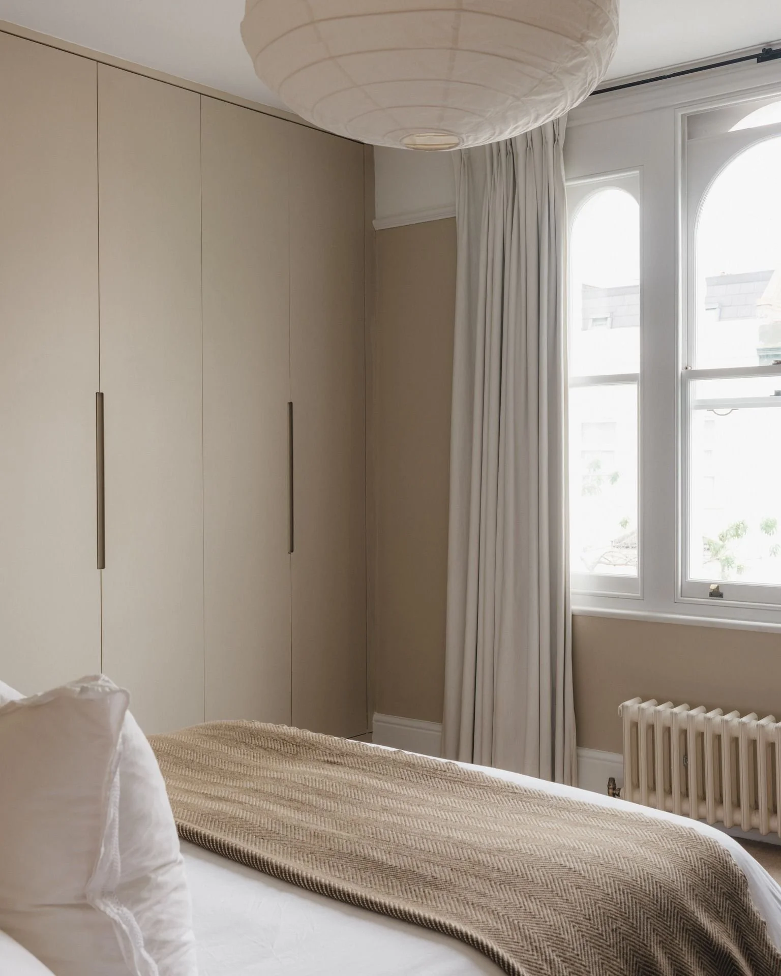 Looking back at this serene bedroom we created in a beautiful Victorian house in Hackney. The warm tones and soft lines come together to create a calming, restful space, perfect for unwinding after a busy day. Every detail has been thoughtfully desig