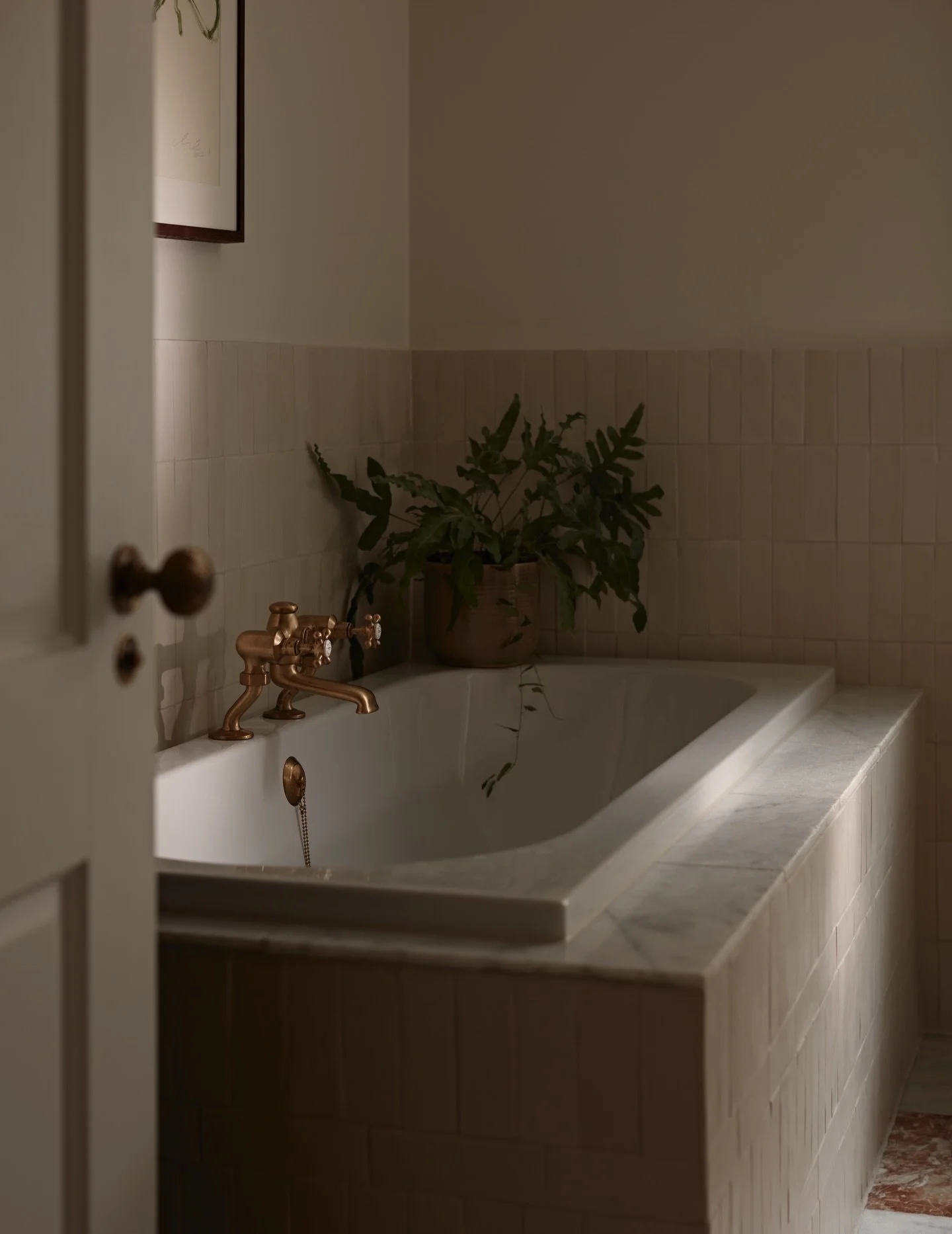 A quiet moment in this North London bathroom, designed by us.

Soft, earthy tones and natural textures sit alongside warm brass details and artisanal tiles, adding depth and tactility to shape a calm, considered space for everyday rituals and relaxat