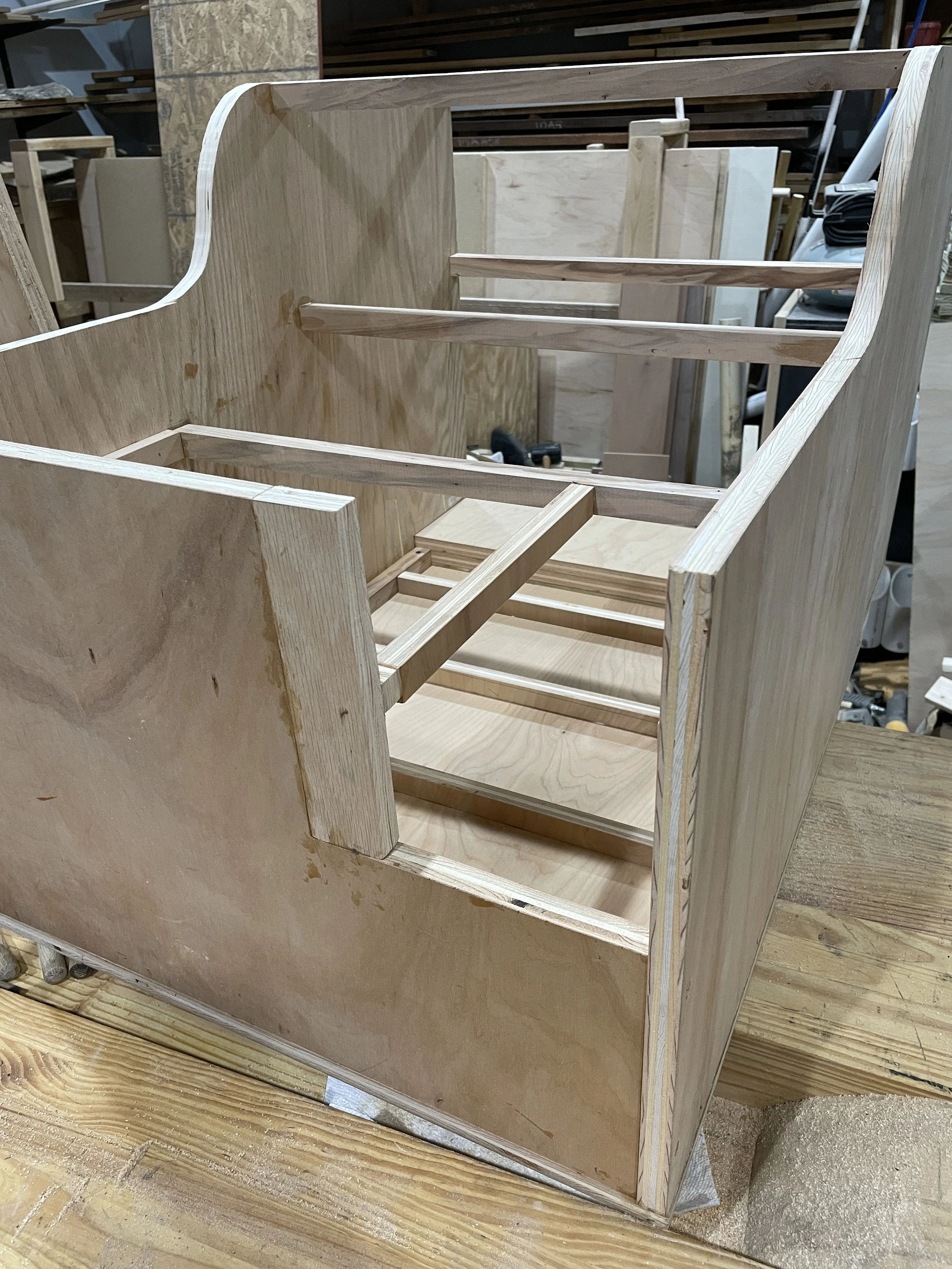 This console will serve as several improvements. We didn't have any cup, phone or storage space between the driver and passenger, but it will keep the two dogs from entering the cab area. My wife did a wonderful job adding the leather trim on top.