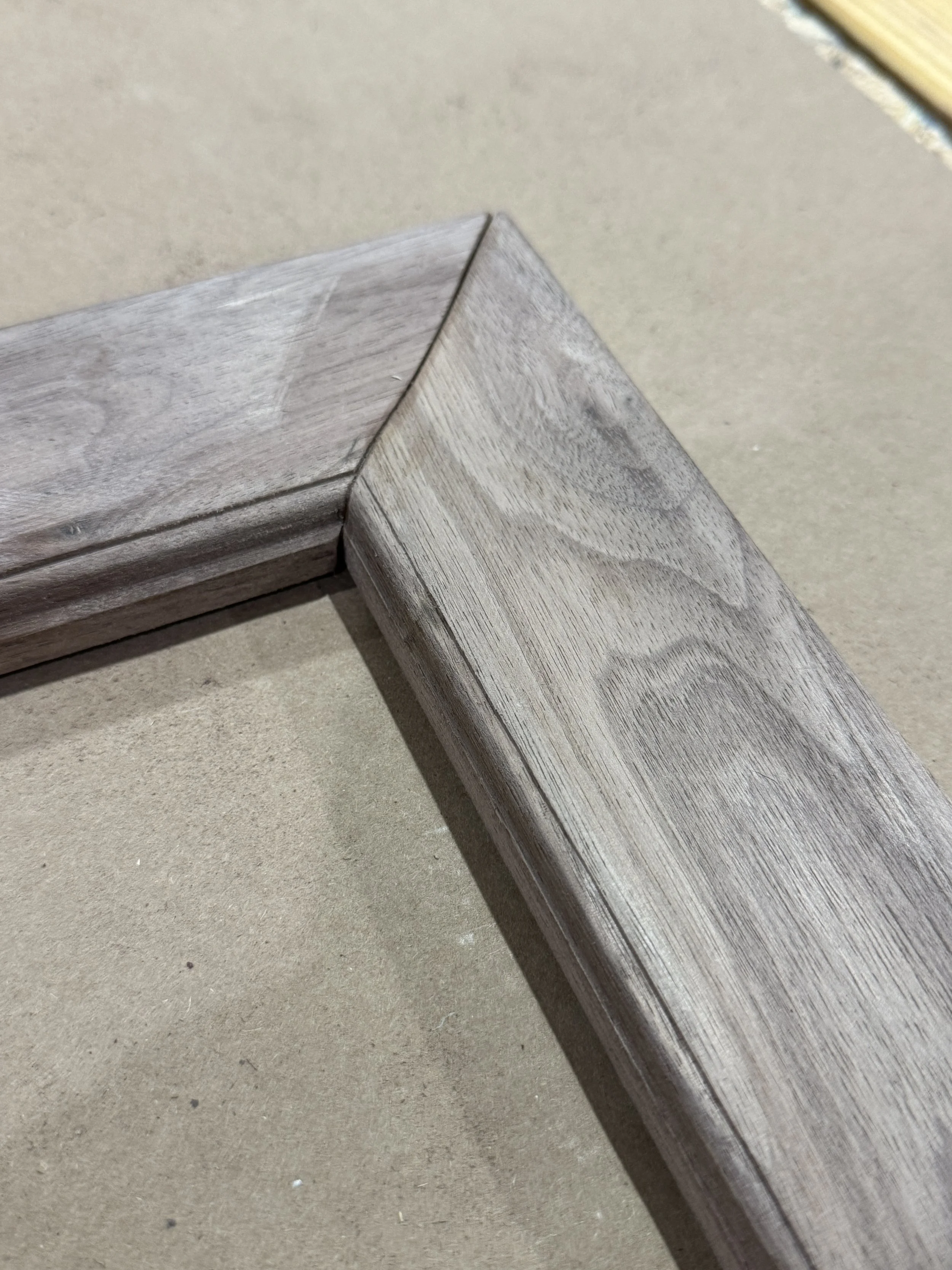 The next several photos show a gap in the mitered ends. Adding a little sawdust from the same wood type and wood glue solves that problem.