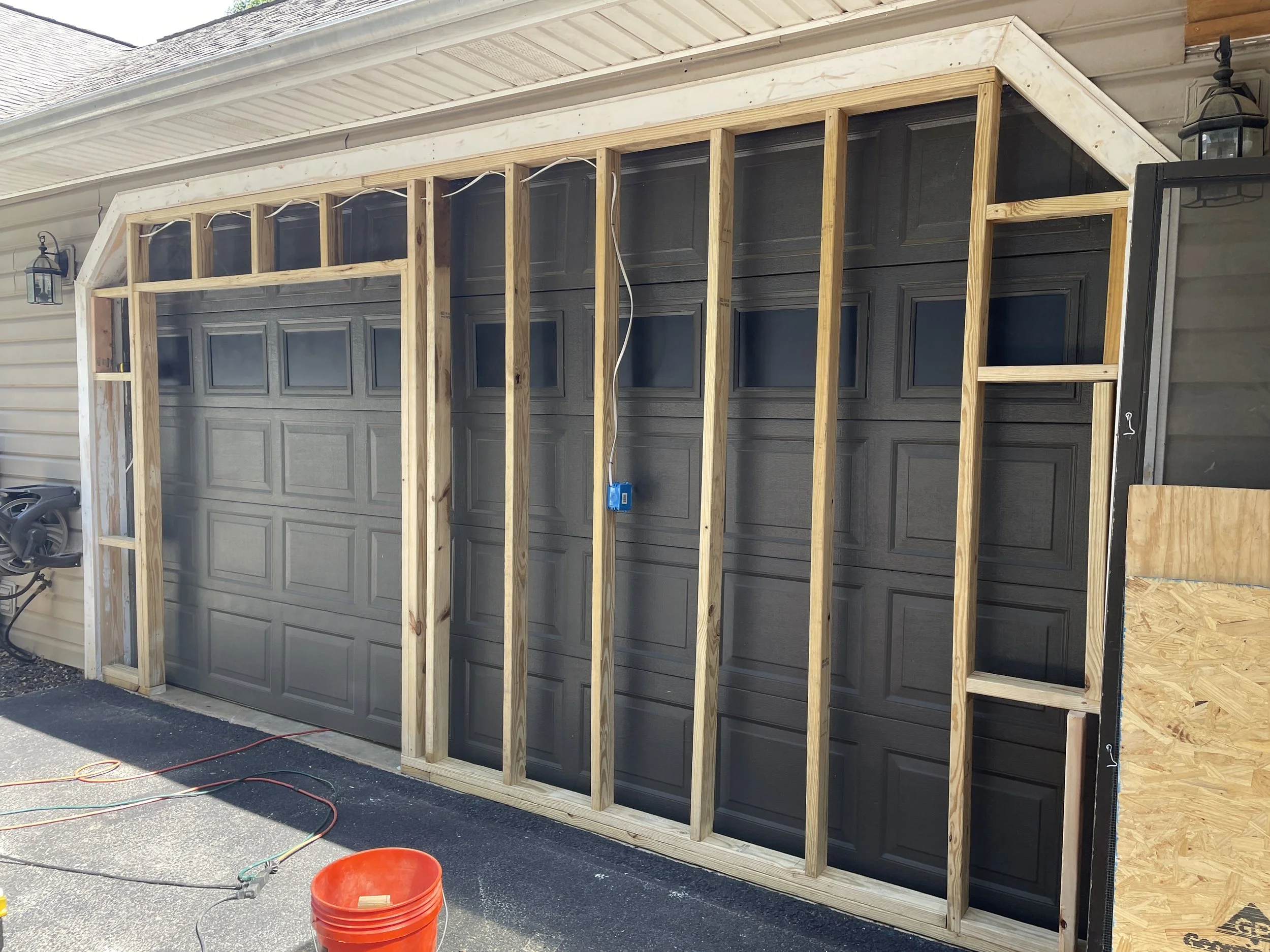 Never thought that the garage door would close even with the new framing in place.