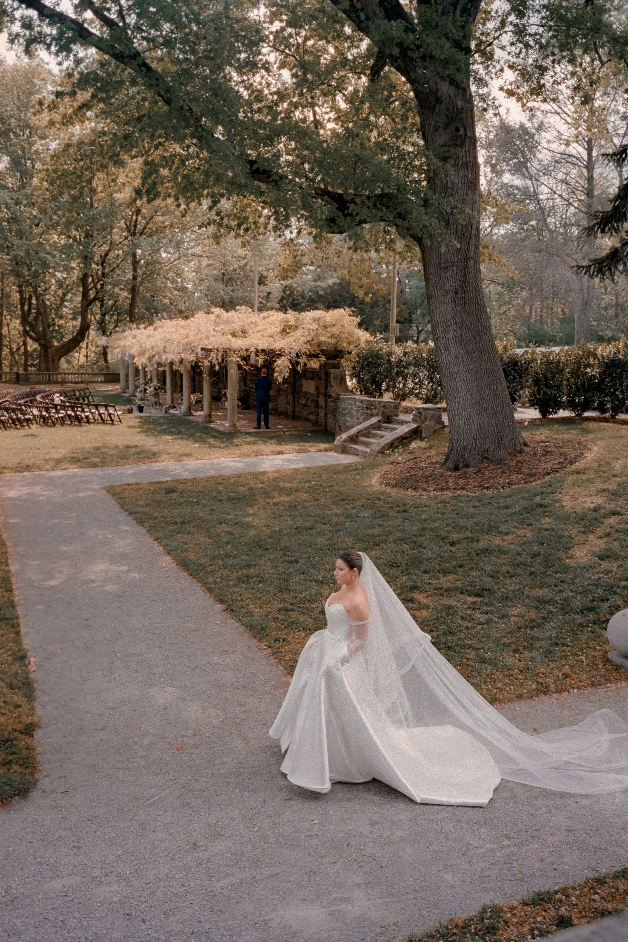 Film wedding portrait of a bride walking through the gardens at Curtis Arboretum in Philadelphia