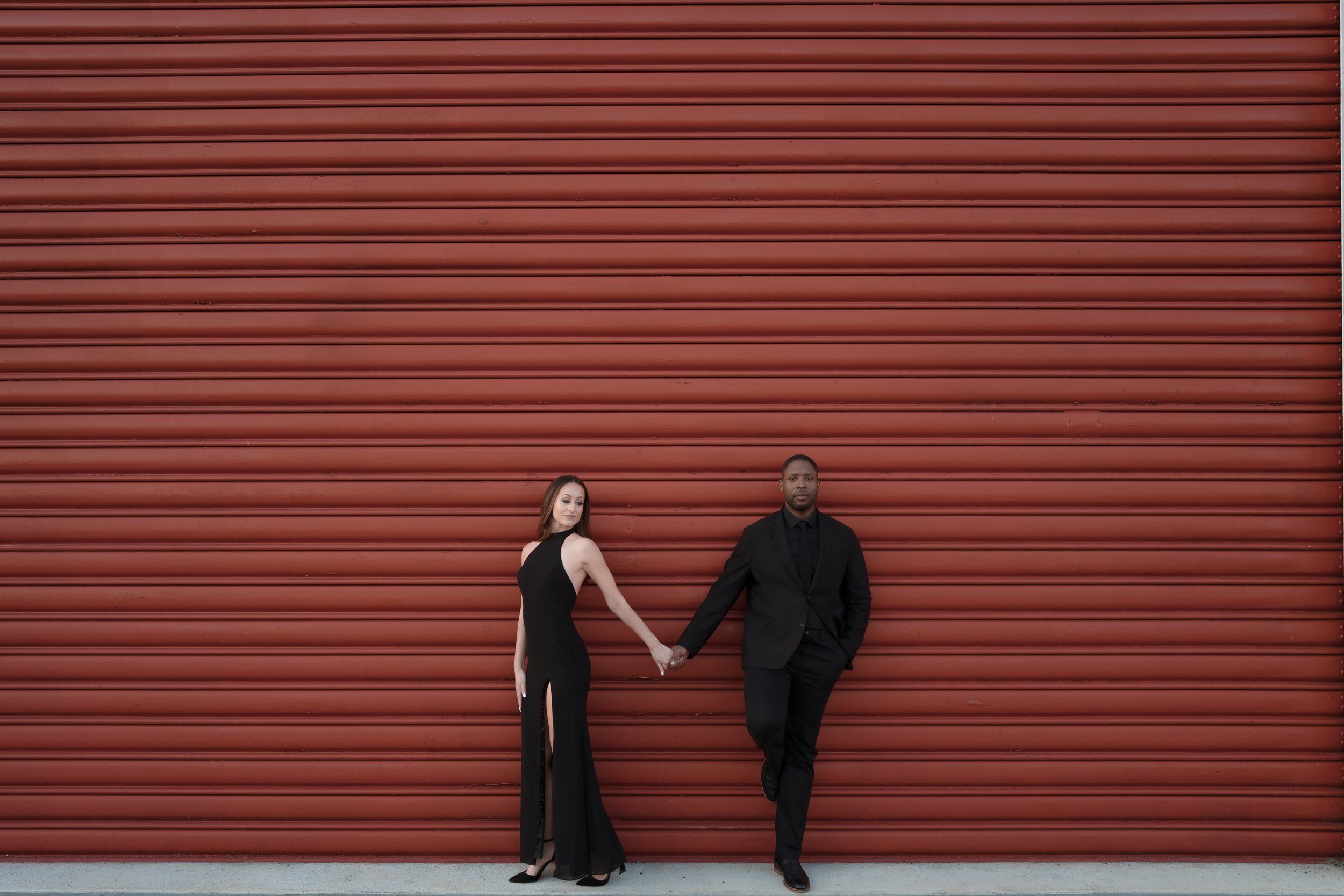 a couple during their engagement session at the navy yard photographed by Nik from Morina Photography