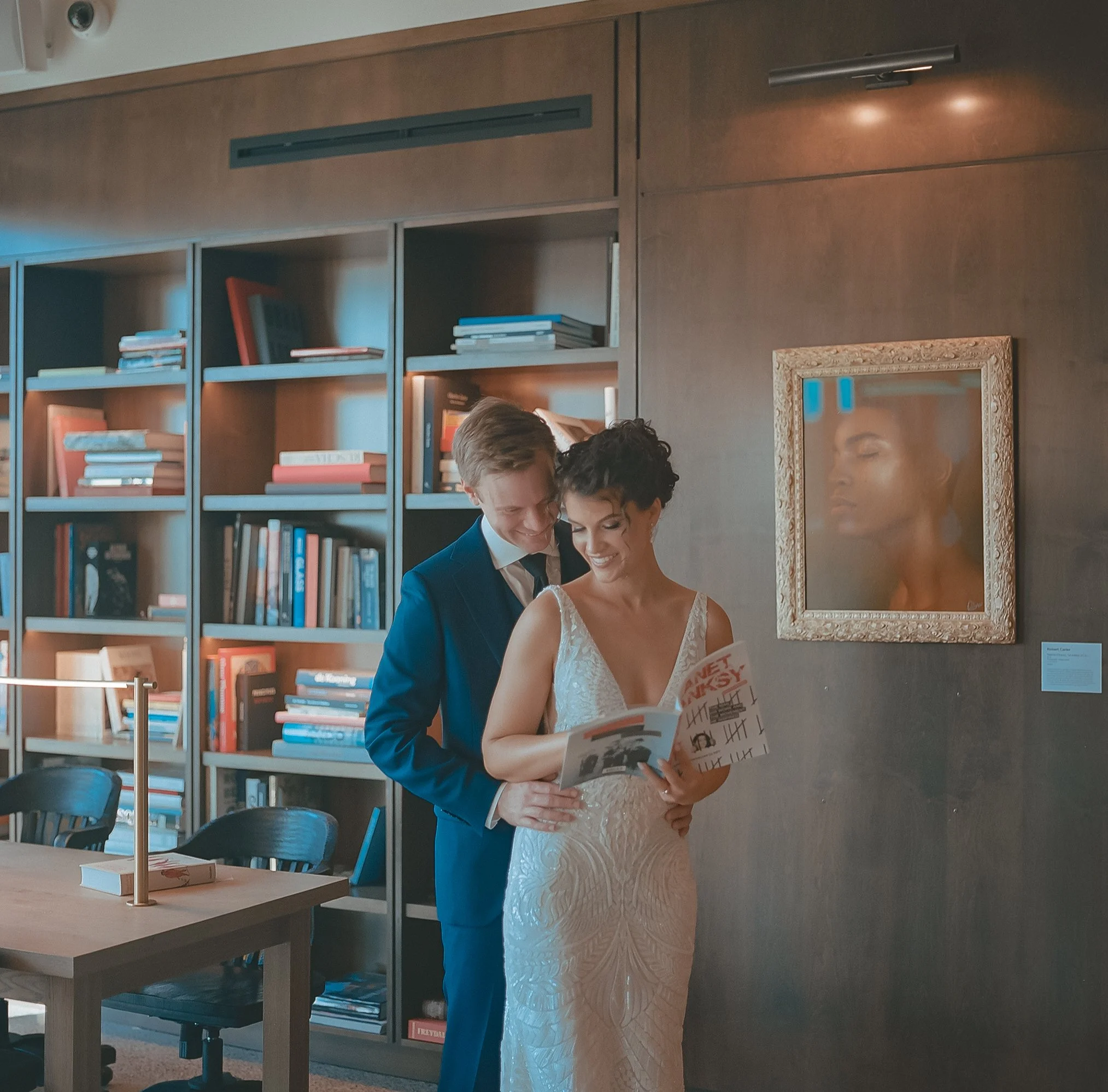 Medium format film wedding portrait of a couple inside a modern library