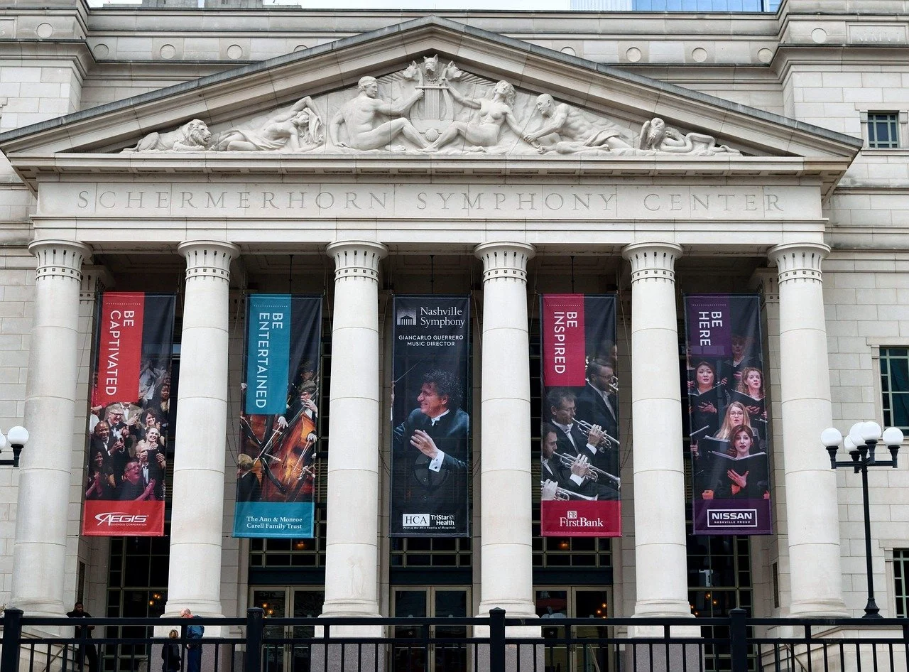 Facade of the Schermerhorn Symphony Center with five large banners featuring musicians and event information.