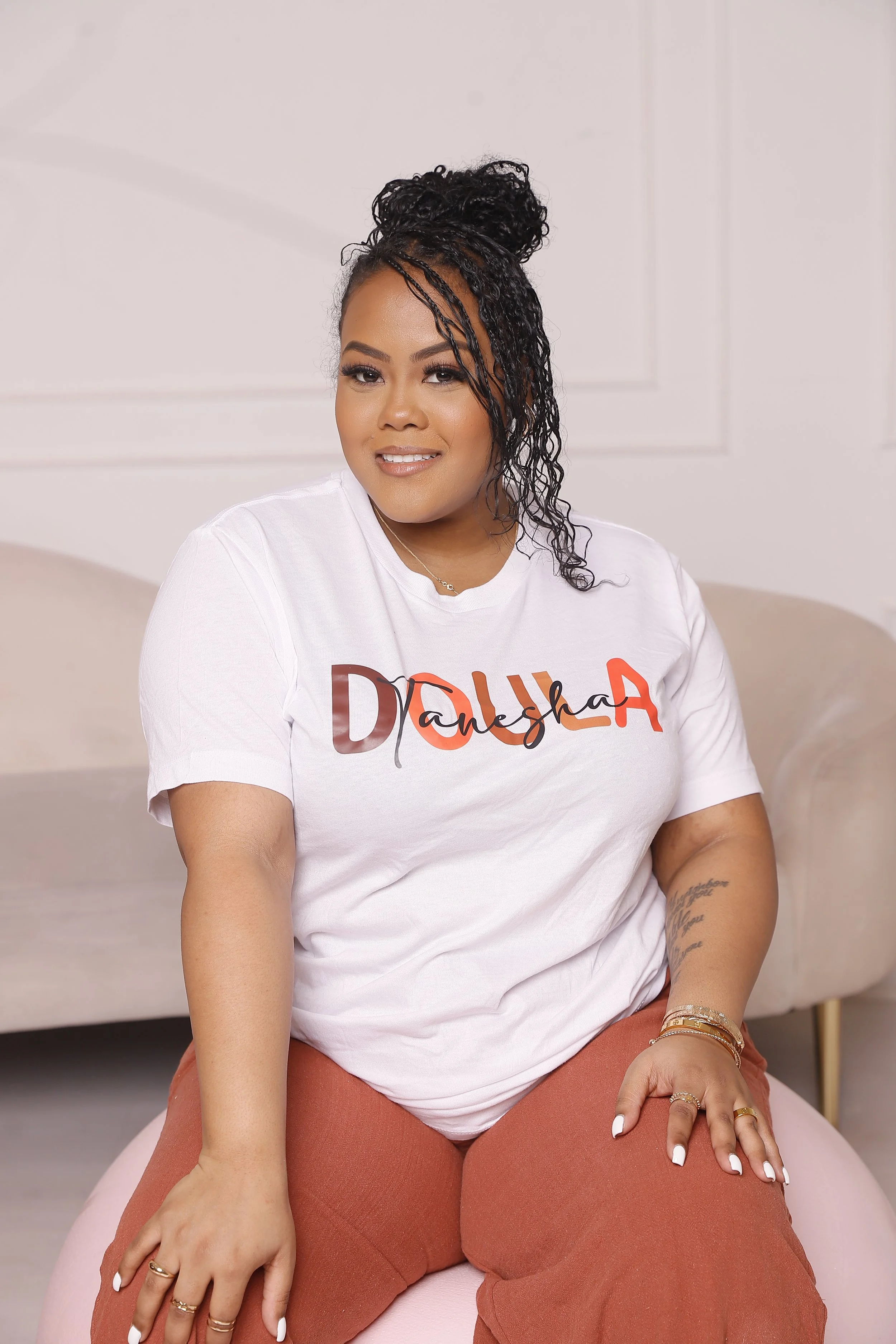 NYC Birth Village Birth, Postpartum and Overnight Doula Tanesha smiling.