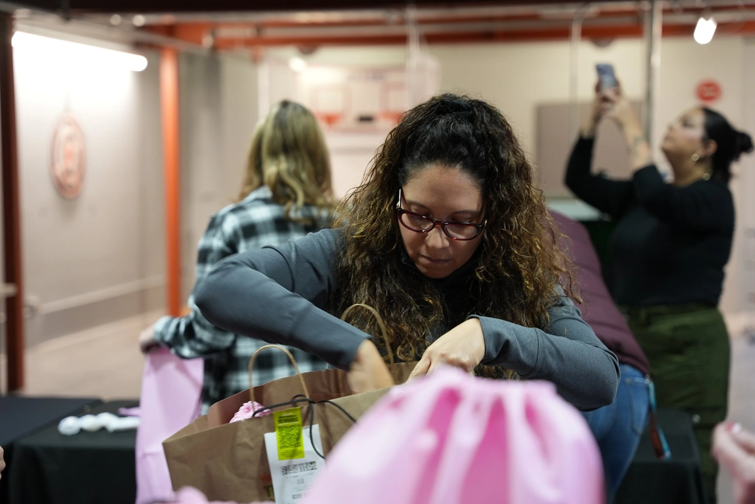 City Rev volunteer packing a Love Bag kit for Serve the City Fort Lauderdale