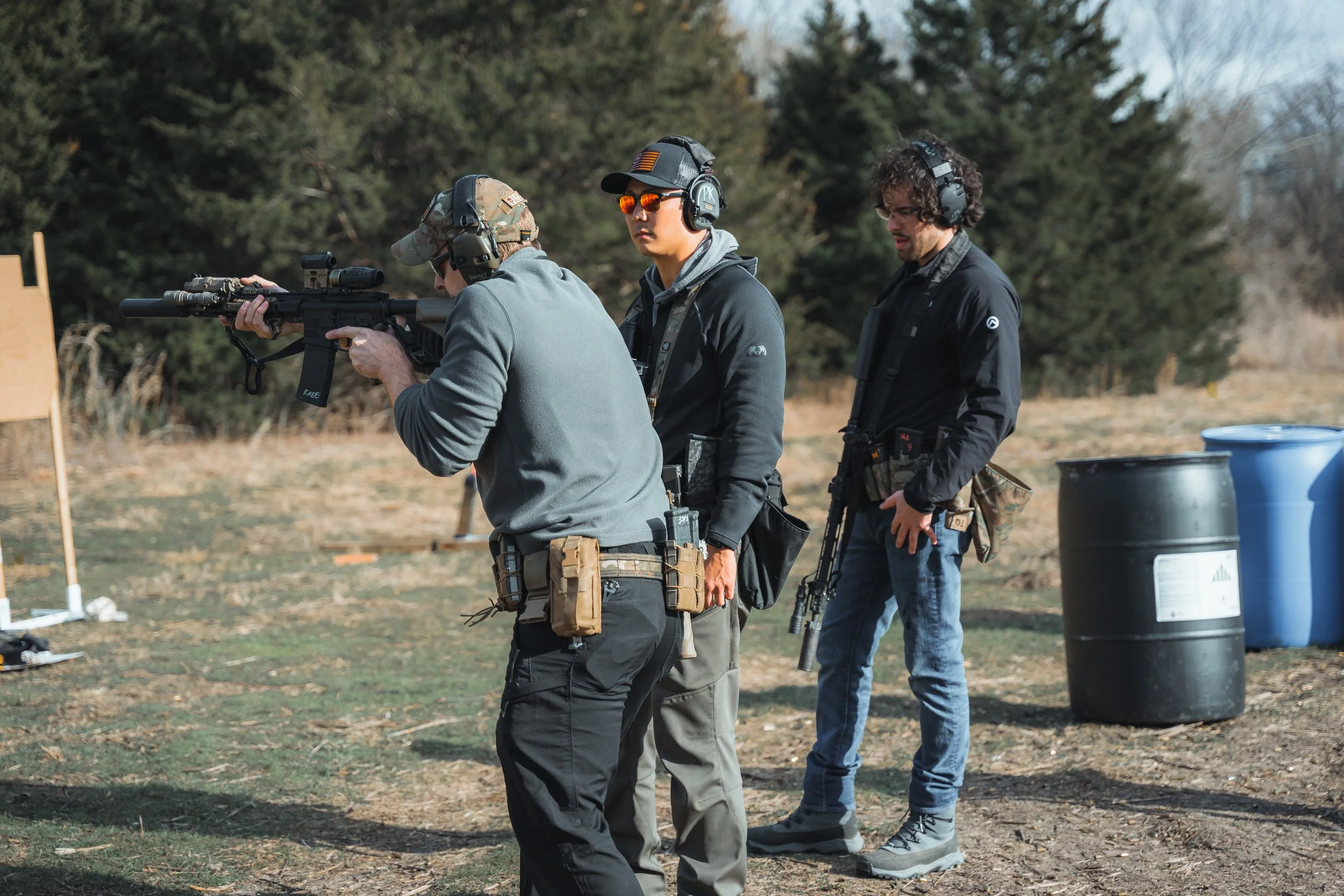A class training together in a private tactical bay at Rooftop Shooting Range