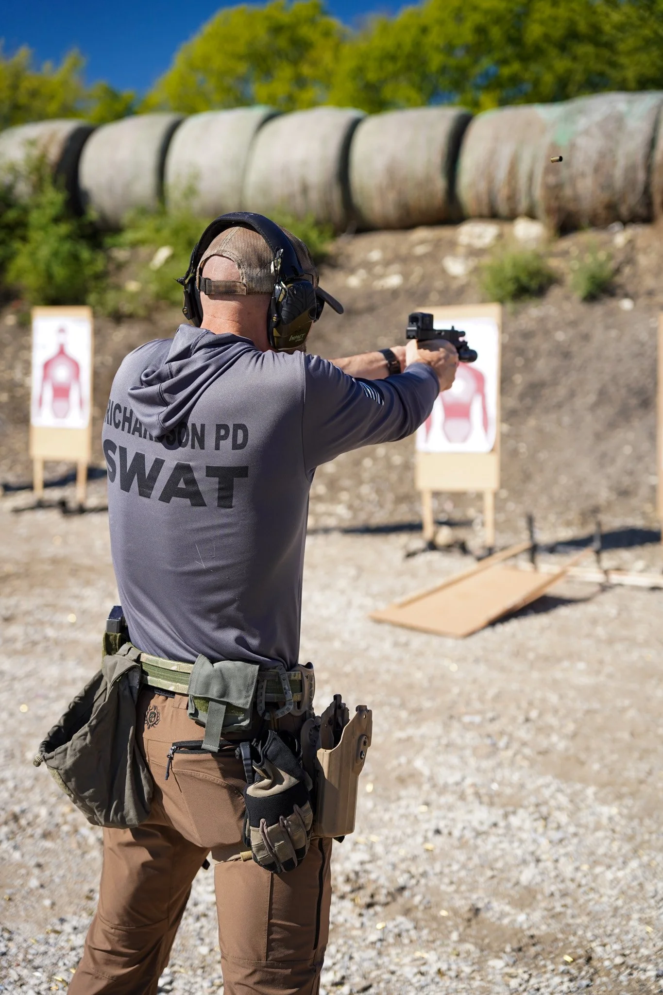 Richardson PD SWAT officer training on a pistol bay at Rooftop Shooting Range in Trenton, TX