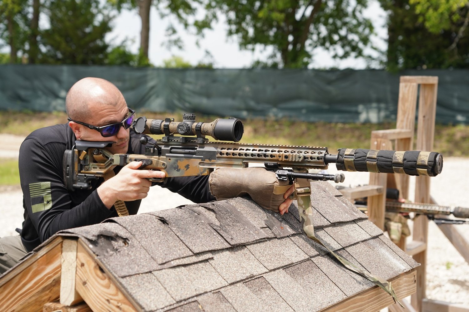 Frisco SWAT sniper shooting from the rooftop position in the 150-yard rifle bay at Rooftop Shooting Range