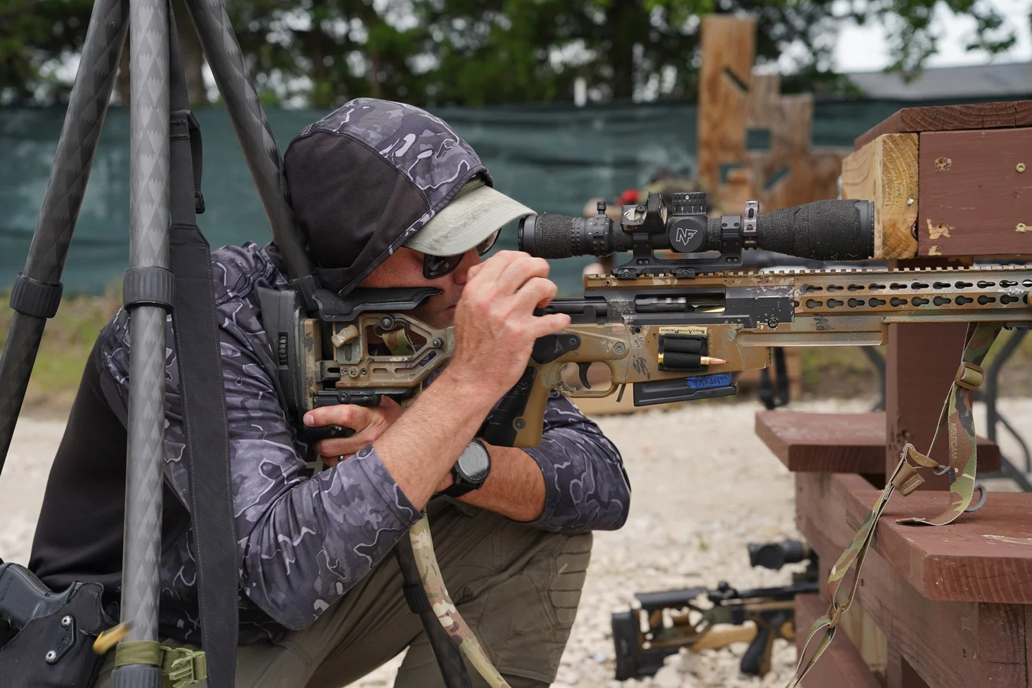 Frisco SWAT sniper shooting from a tripod on the rifle bay at Rooftop Shooting Range