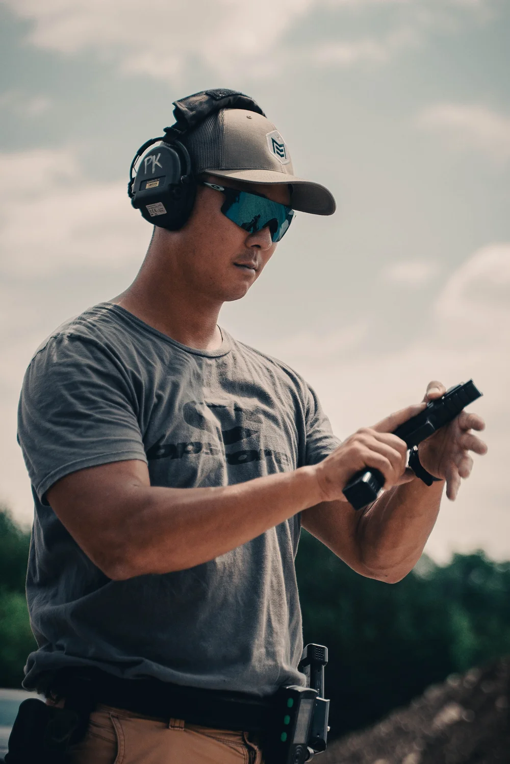 Rooftop Shooting Range founder Pete handling a pistol on the range