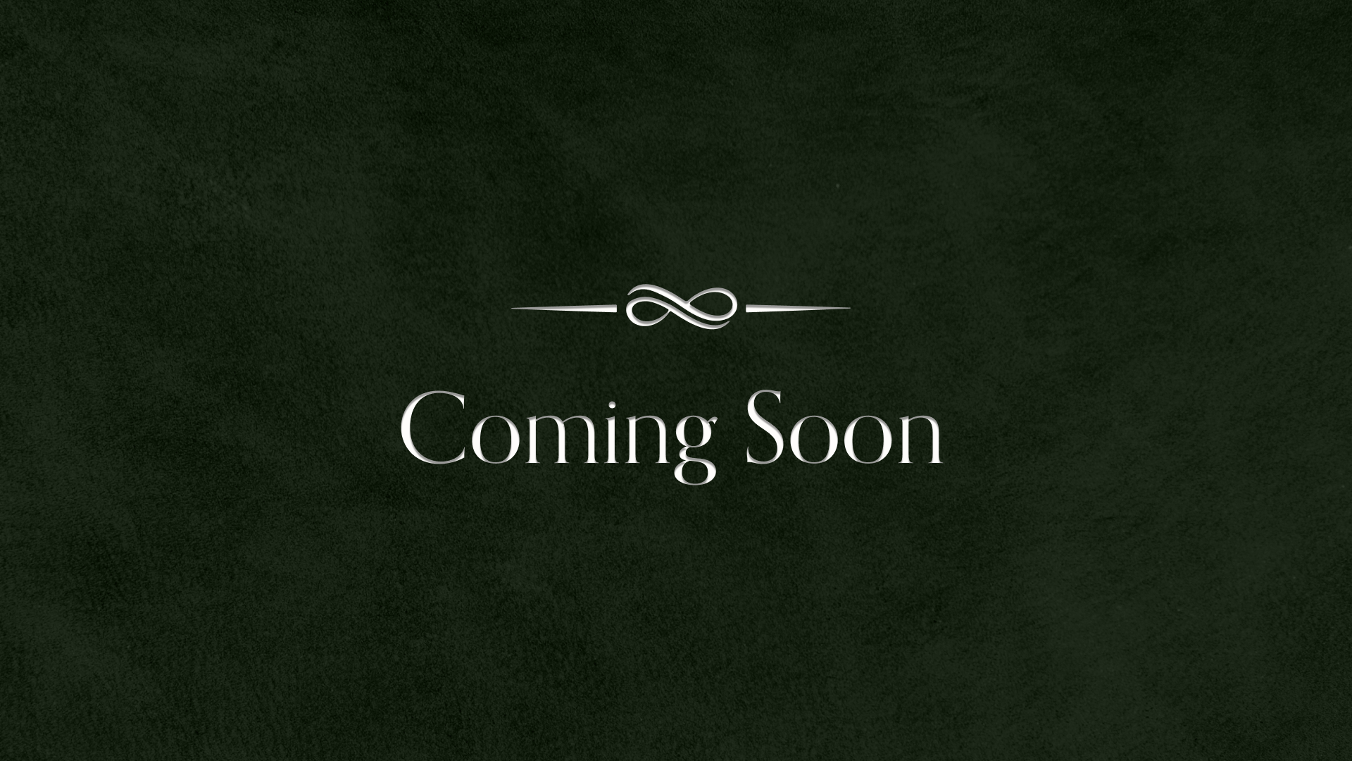 A dark green background with a decorative white ampersand and the words "Coming Soon" below it.