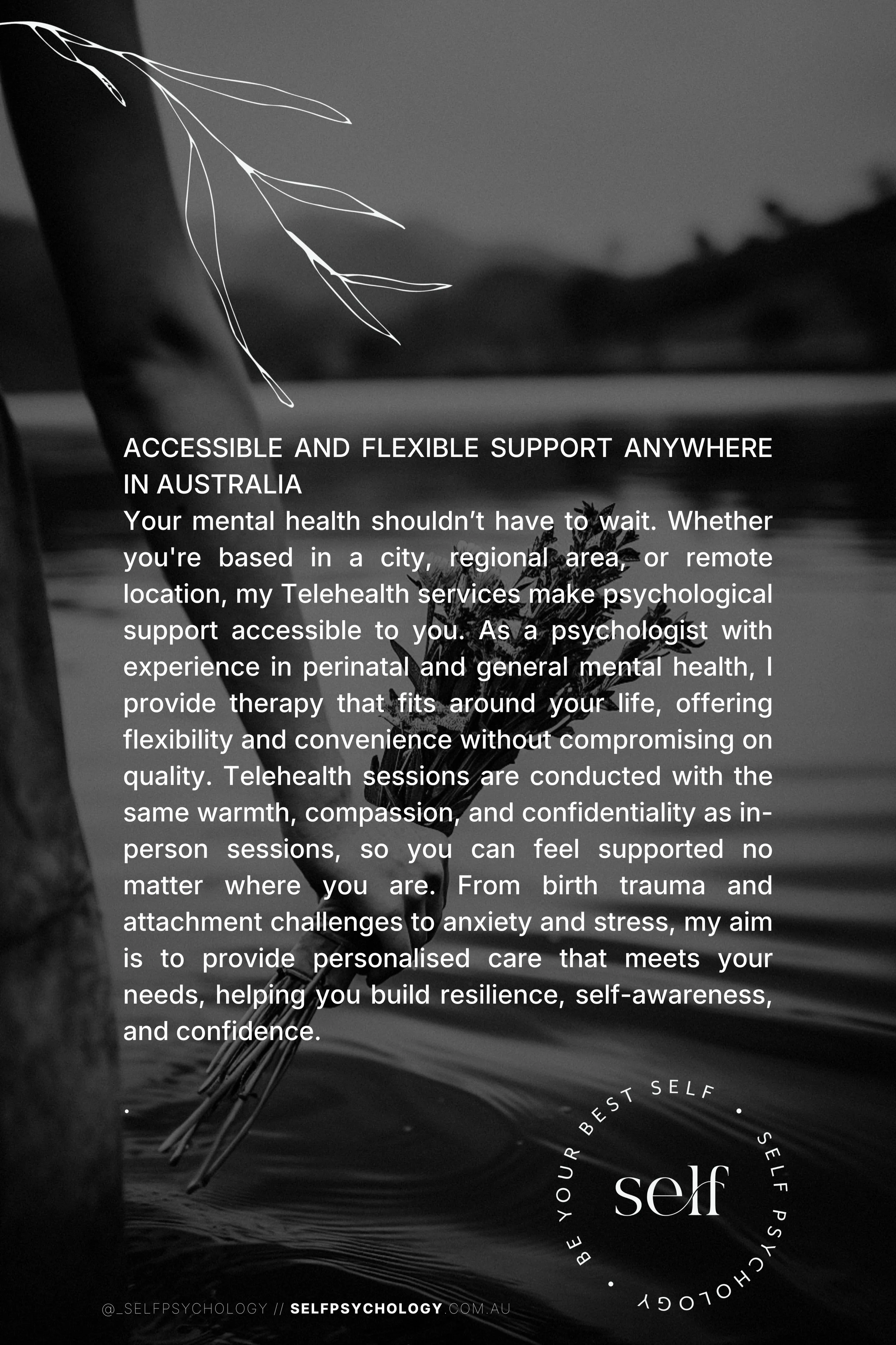 A person holding a small bunch of wildflowers near the water at sunset or sunrise, with a tree branch in the foreground and mountains or hills in the background.