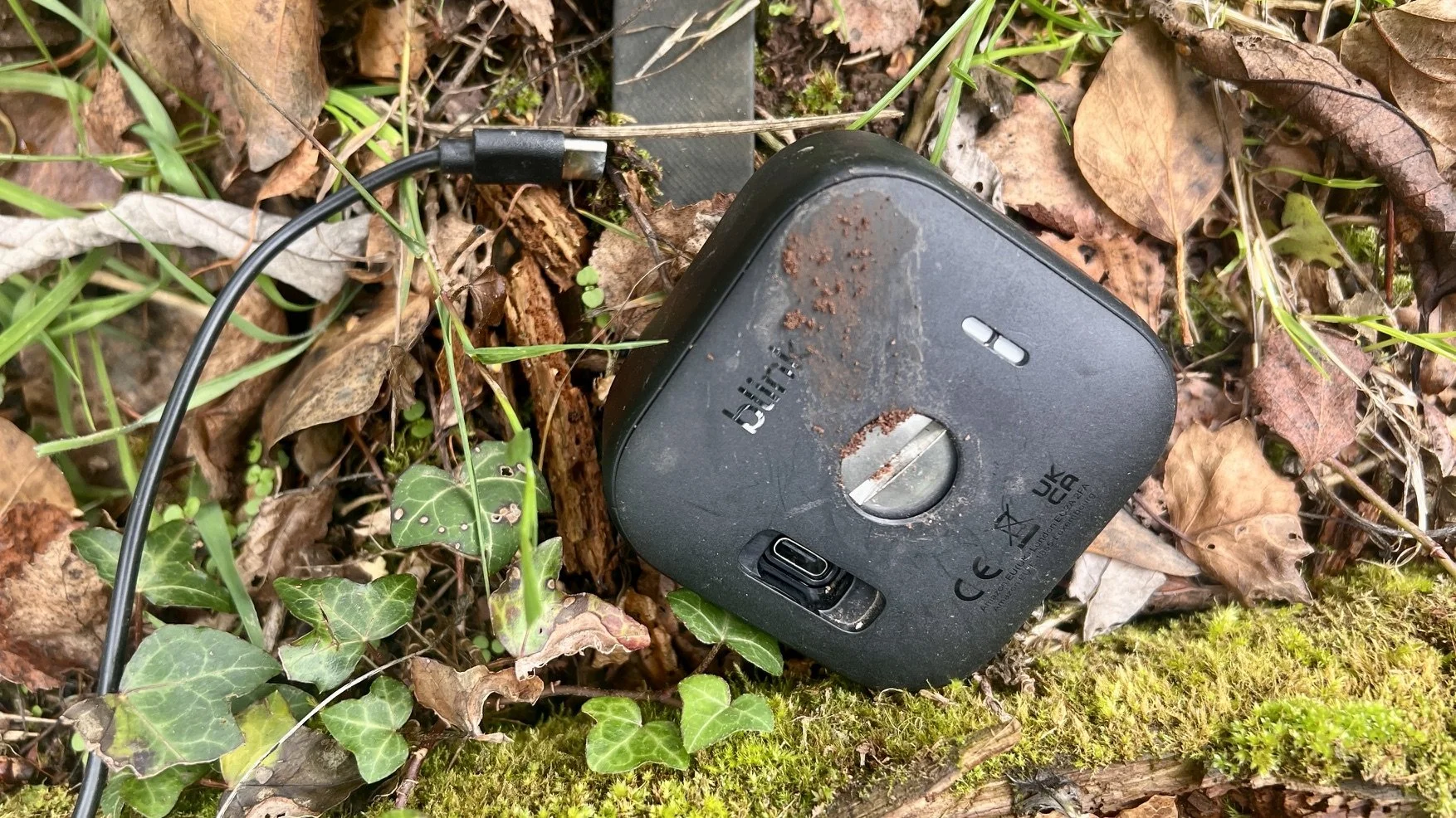 A Blink Outdoor 4 camera on the floor having been trampled by cows.