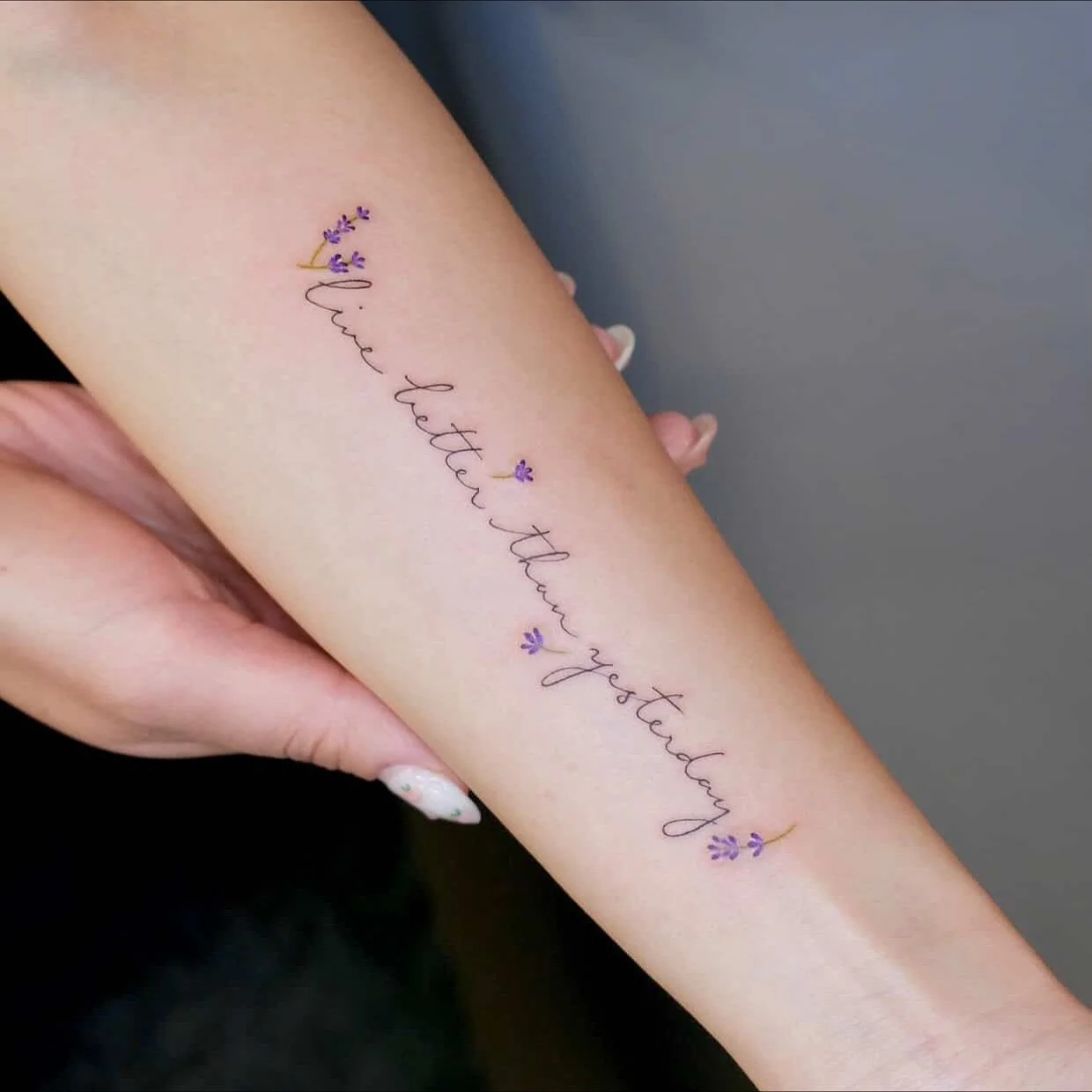 Script with lavender 💜
Artist: @tszching.tattoo 
________________________________________________
[At Off the Ground Ink, we bring your tattoo ideas to life! 💭 For bookings and inquiries, reach out to us by email at offthegroundink@gmail.com]