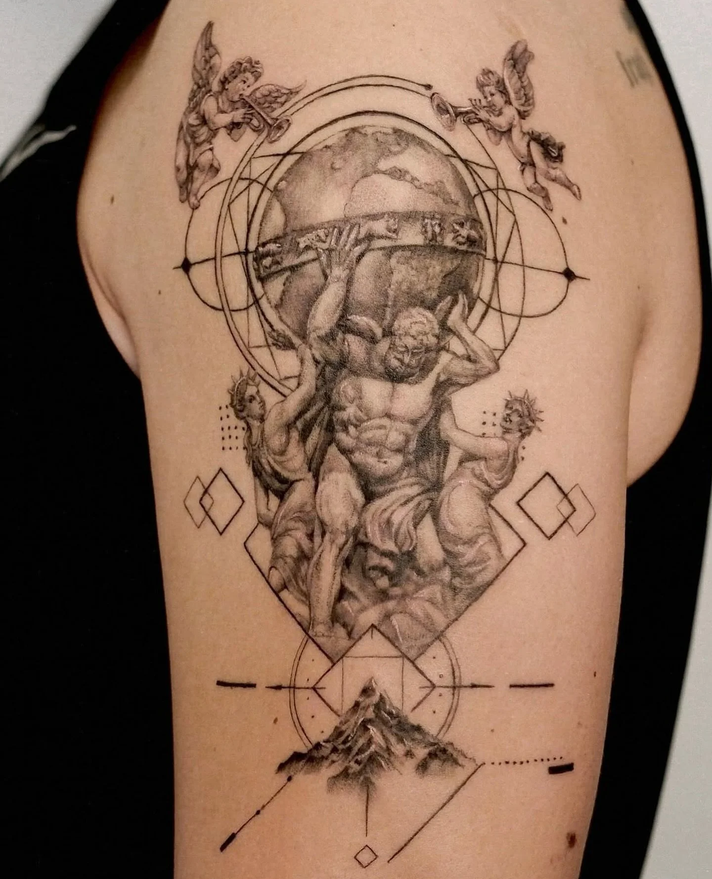 Micro realism Atlas+Cherubs 👼
Artist: @eccc.ink 
________________________________________________
[At Off the Ground Ink, we bring your tattoo ideas to life! 💭 For bookings and inquiries, reach out to us by email at offthegroundink@gmail]