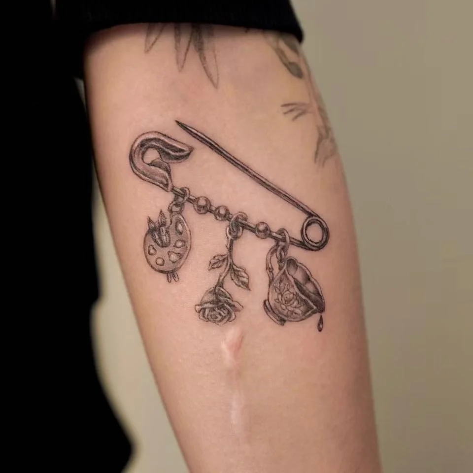 Collecting moments, one charm at a time.🧷 
Done by@l @eccc.ink 
#microrealismtattoo #blackandgreytattoos 
&mdash;&mdash;&mdash;&mdash;&mdash;&mdash;&mdash;&mdash;&mdash;&mdash;&mdash;&mdash;&mdash;&mdash;&mdash;&mdash;
It&rsquo;s more than just ink&