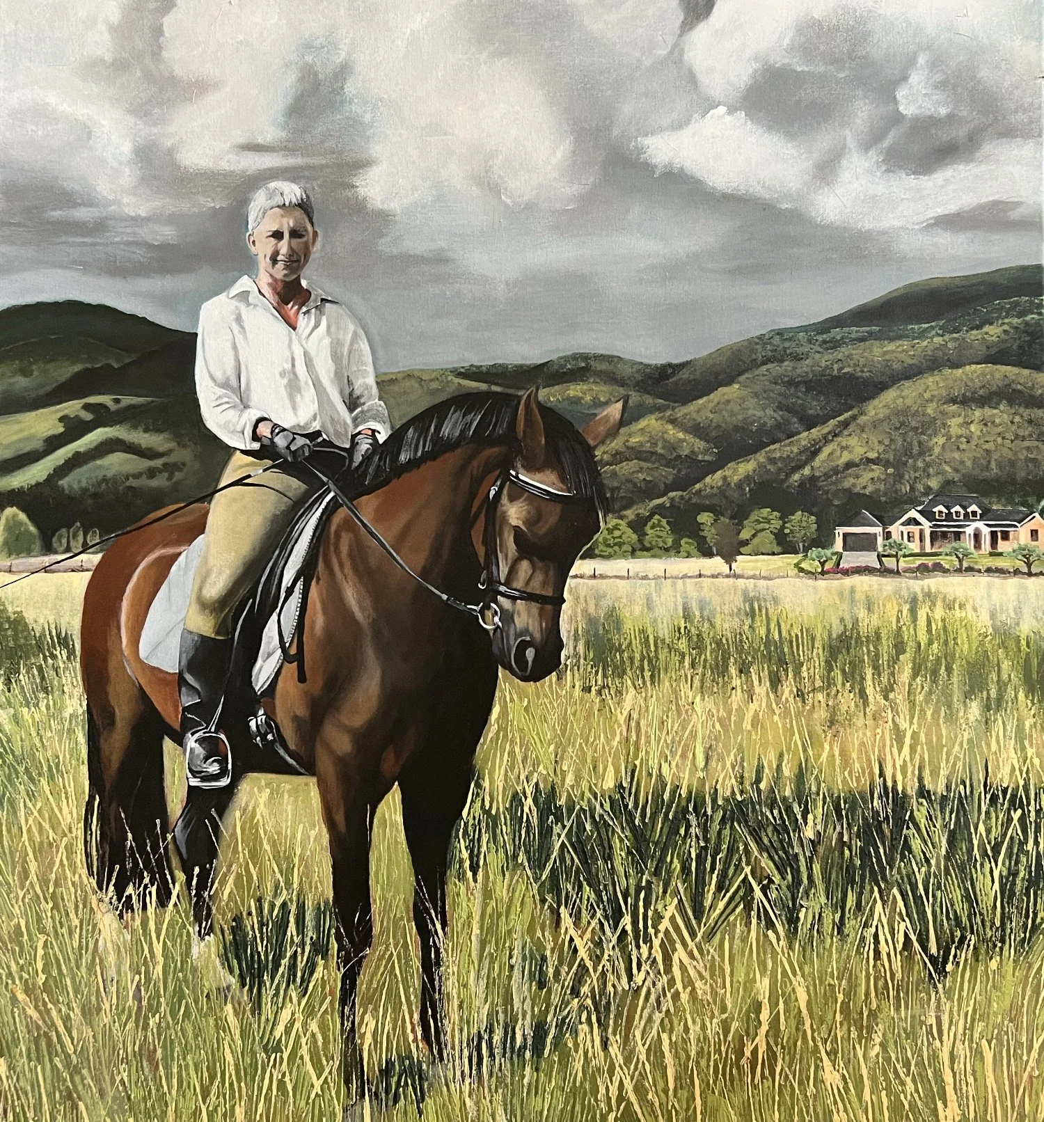 Realistic painting of a woman on a horse in a paddock of grass with hills in the background.