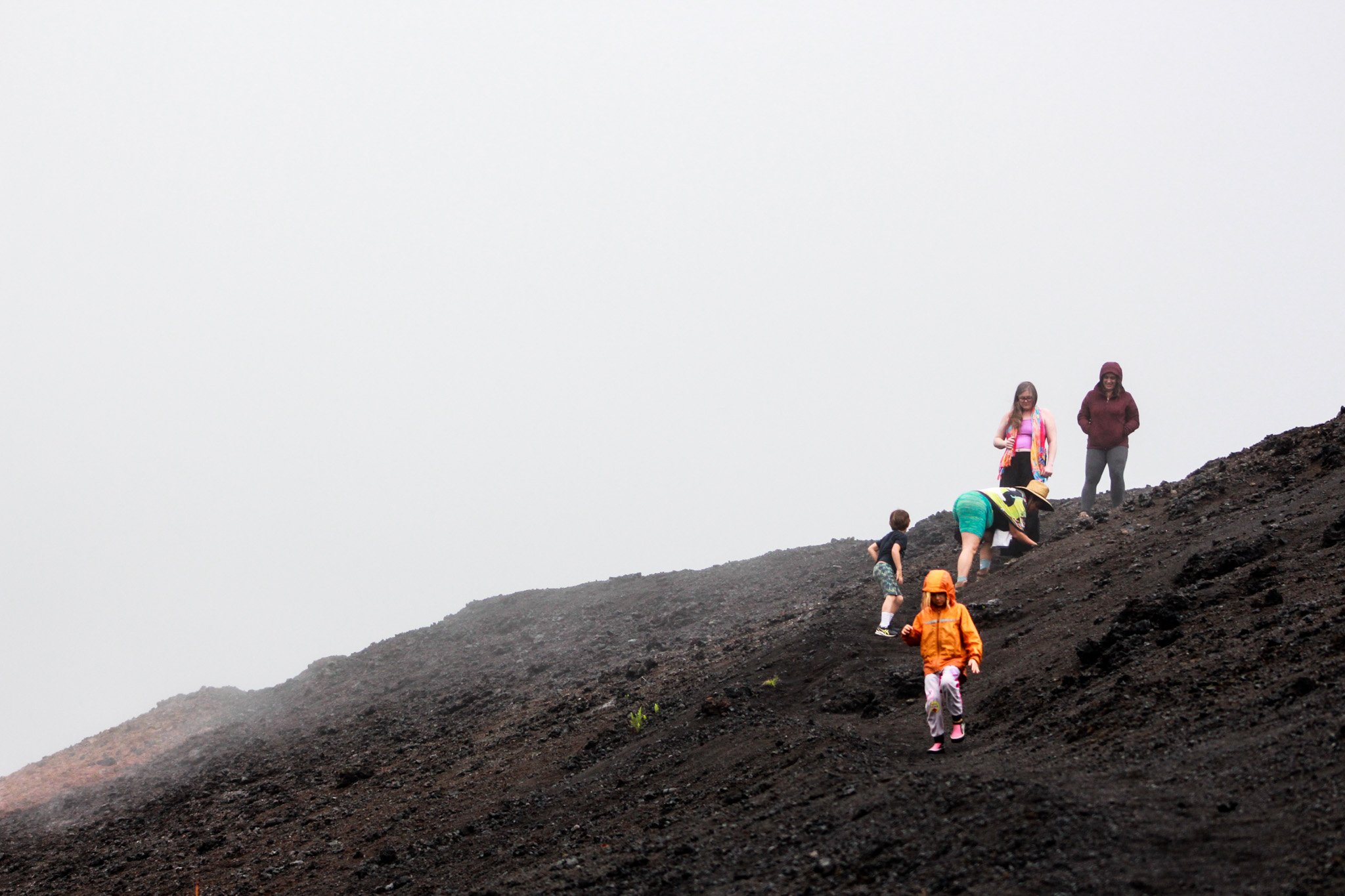 Moana Miller, 6, of Kalapana, leads her family down to where Fissure 8 is located at the Leilani Estates subdivision.