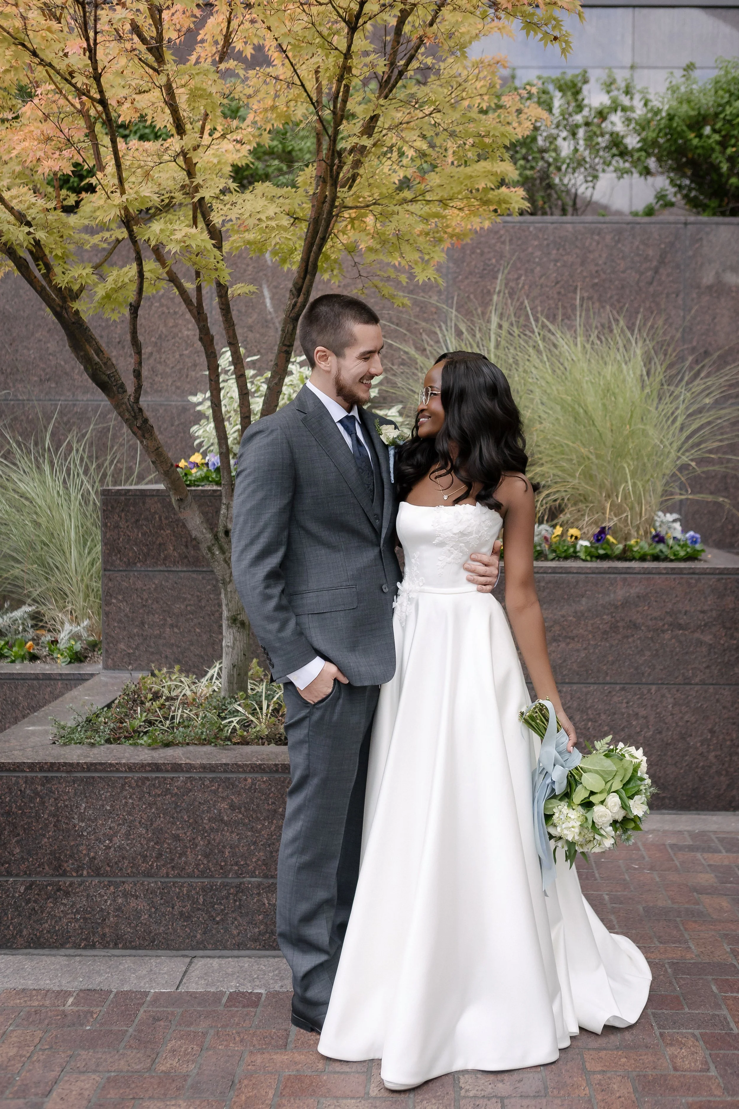  Ceci and Austin the bride and groom posing near Columbia Center in Seattle 