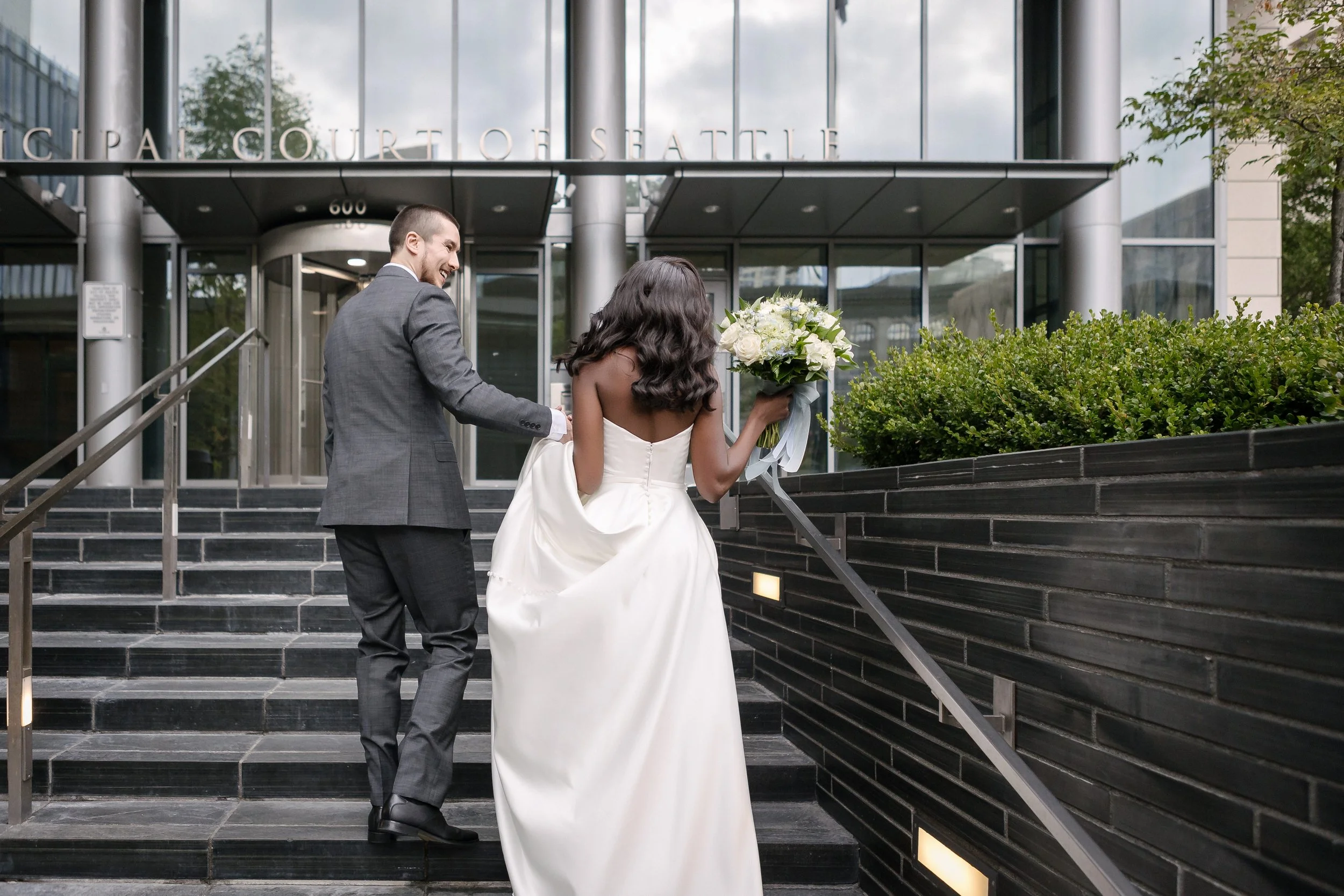wedding couple outside Seattle Municipal Court stairs