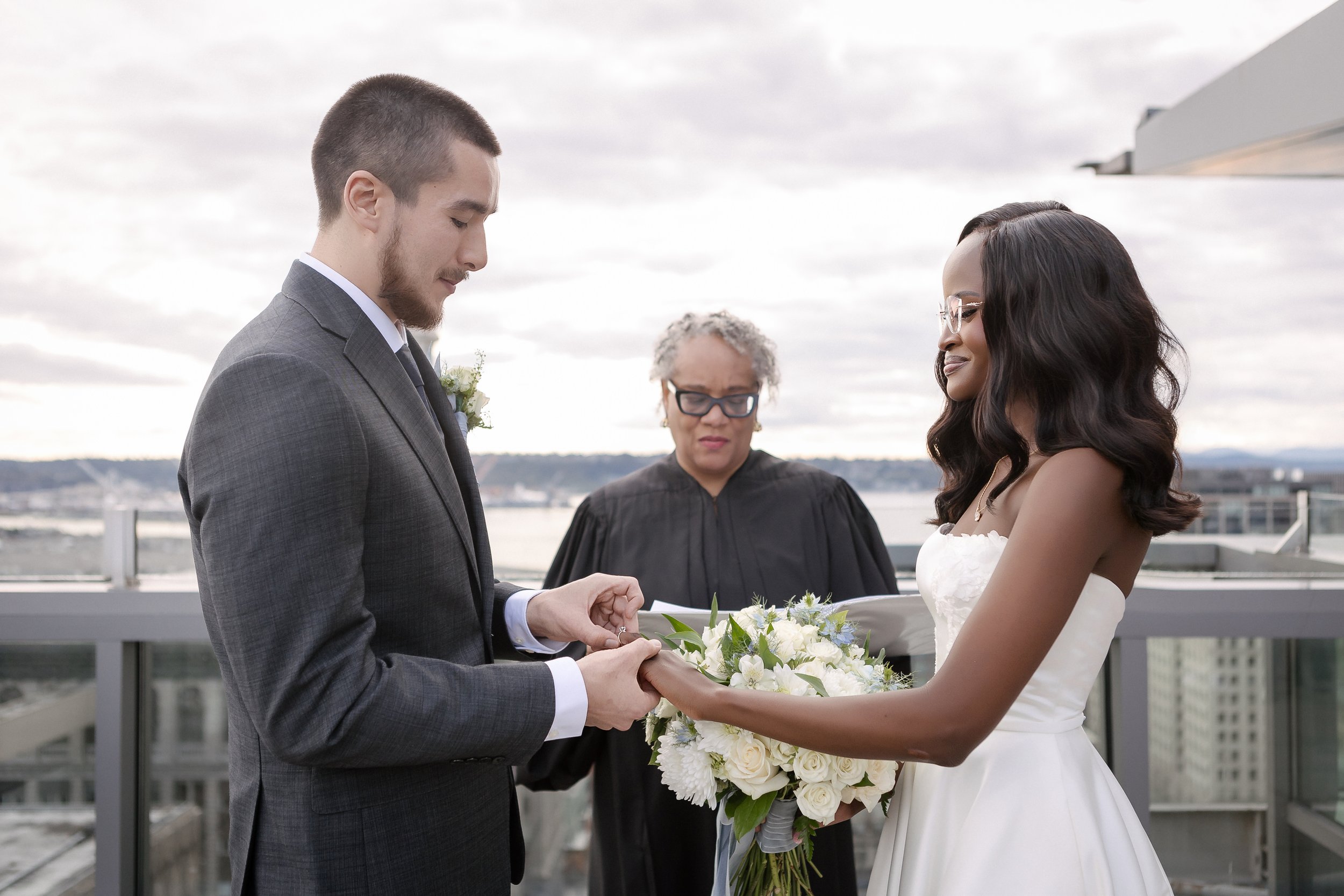  Wedding ring exchange during Seattle courthouse ceremony 