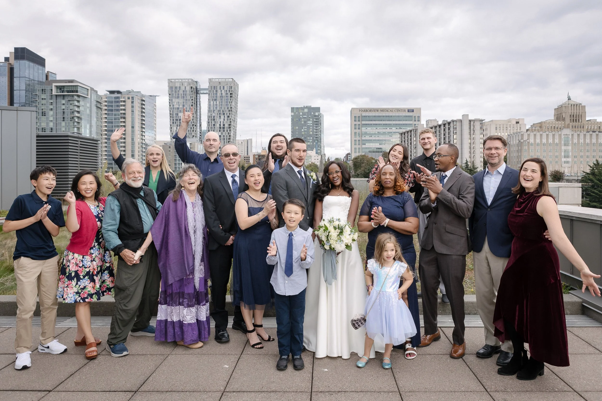  Newly married couple celebrating outside the courthouse with family   