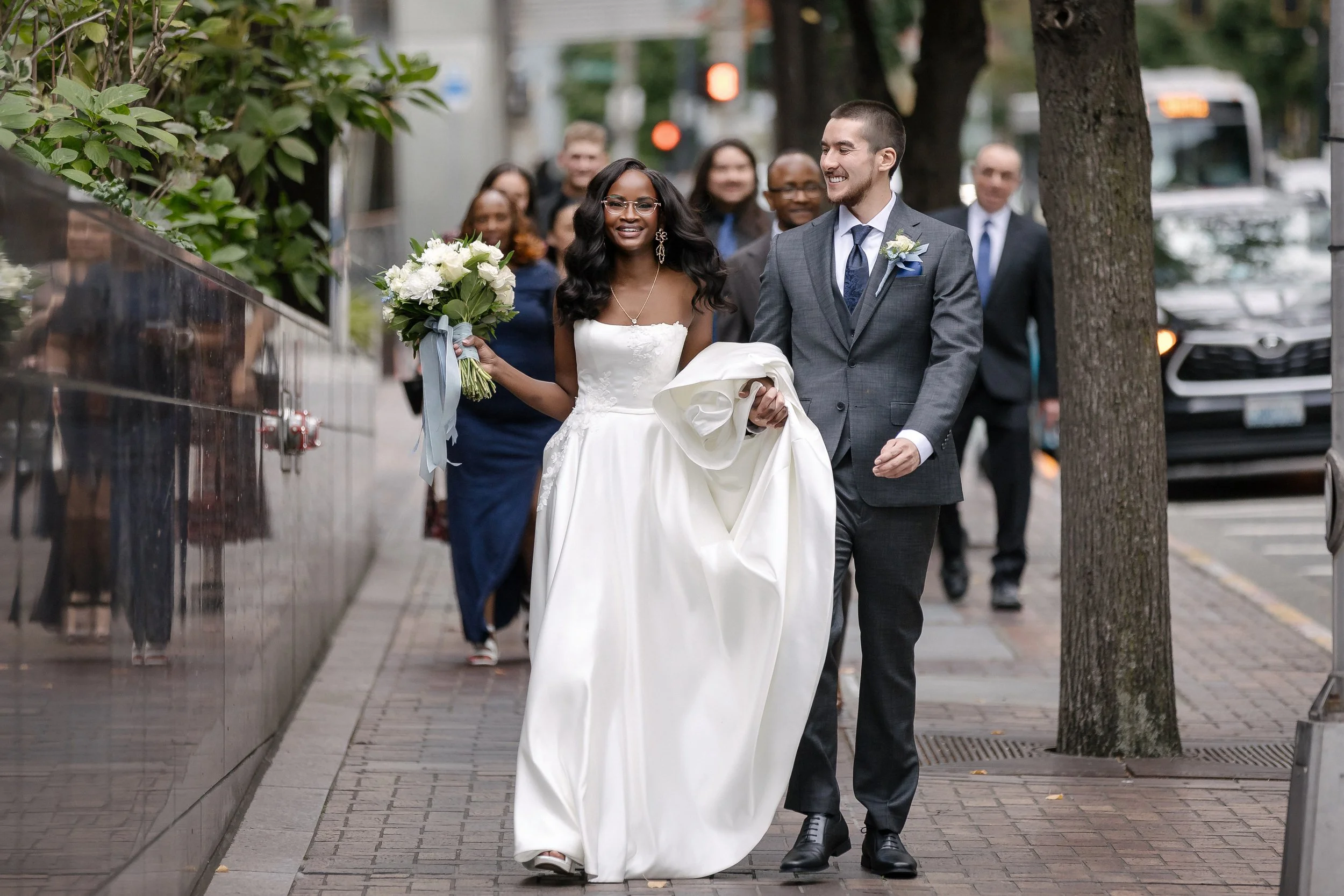 Bride and groom walking through downtown Seattle