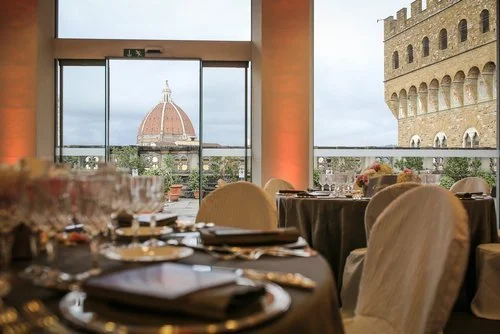 Elegant dining setup with view of Florence's Duomo, Italy