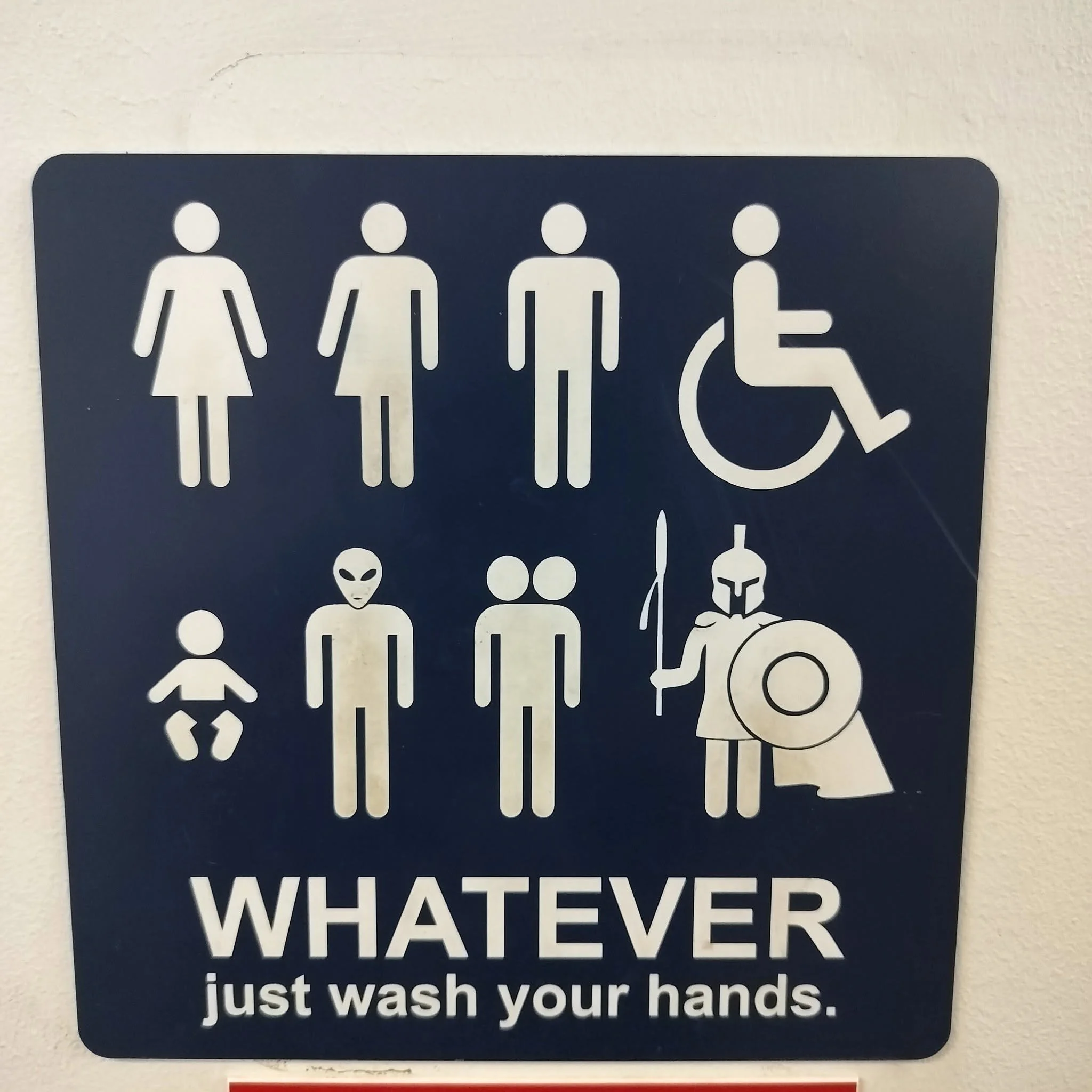 Sign with icons of women, men, children, person with wheelchair, alien, and mystery figure with the text "WATER" and part of a message about washing hands.