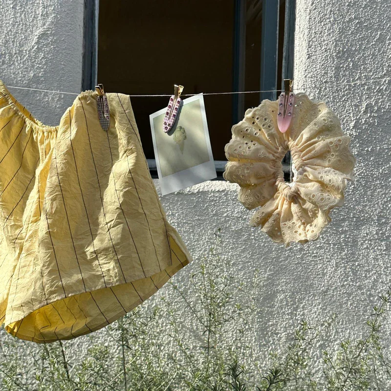 Emi Jay eyelet scrunchie in soft yellow fabric with ruffled texture