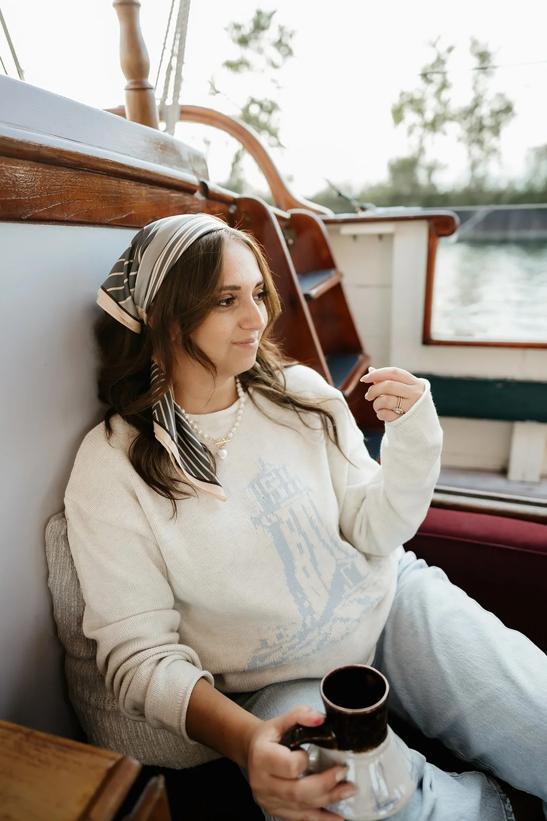 Nautical fall lighthouse sweater outfit with pearl necklace