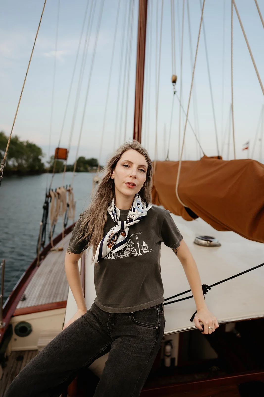 Charcoal Captain’s Quarters graphic tee with vintage nautical scene featuring candles, books, lantern, skull and sailboat details.