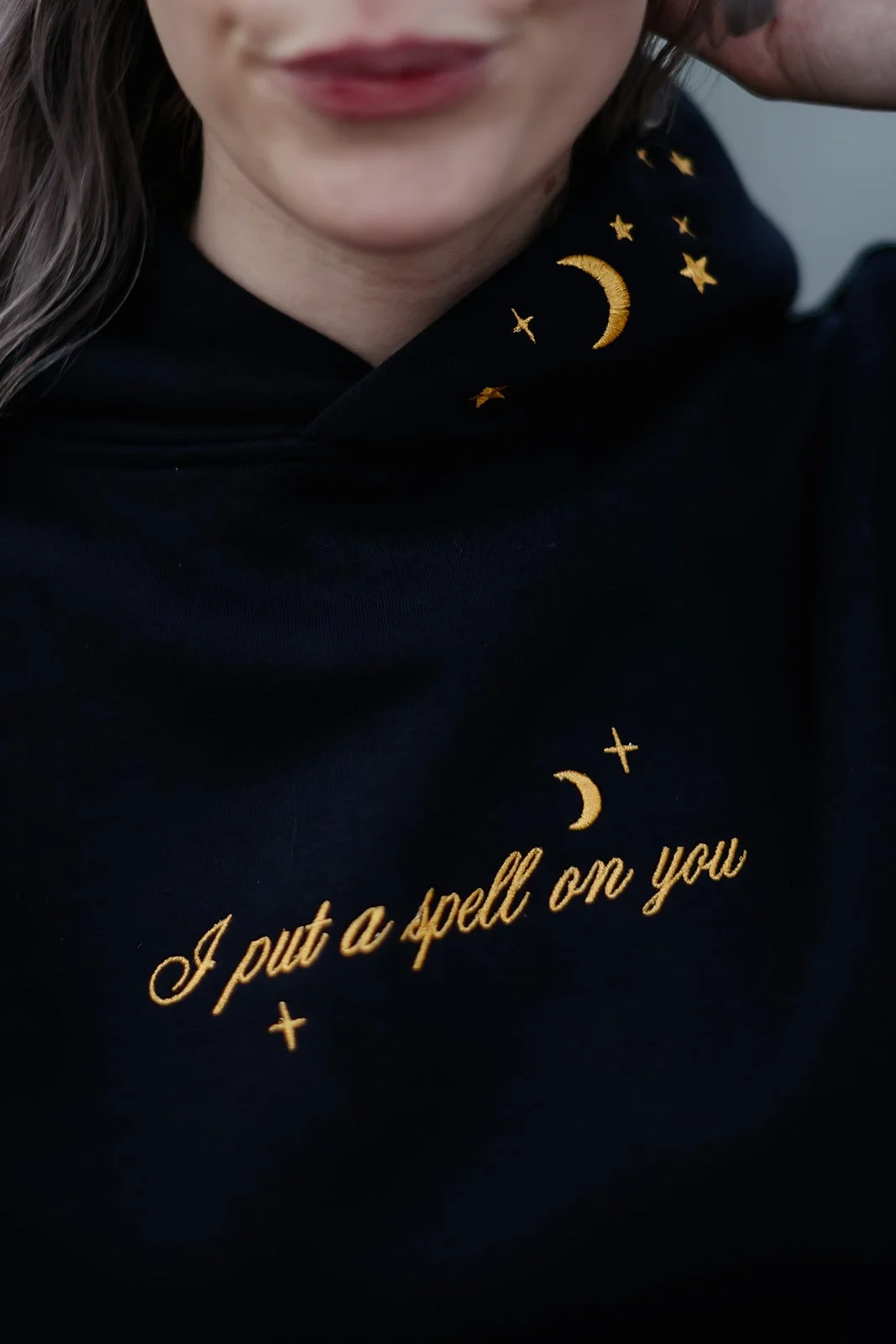 Navy witchy graphic hoodie for fall and Halloween featuring a celestial wheel of fortune design with gold moon, stars, constellations and compass details.