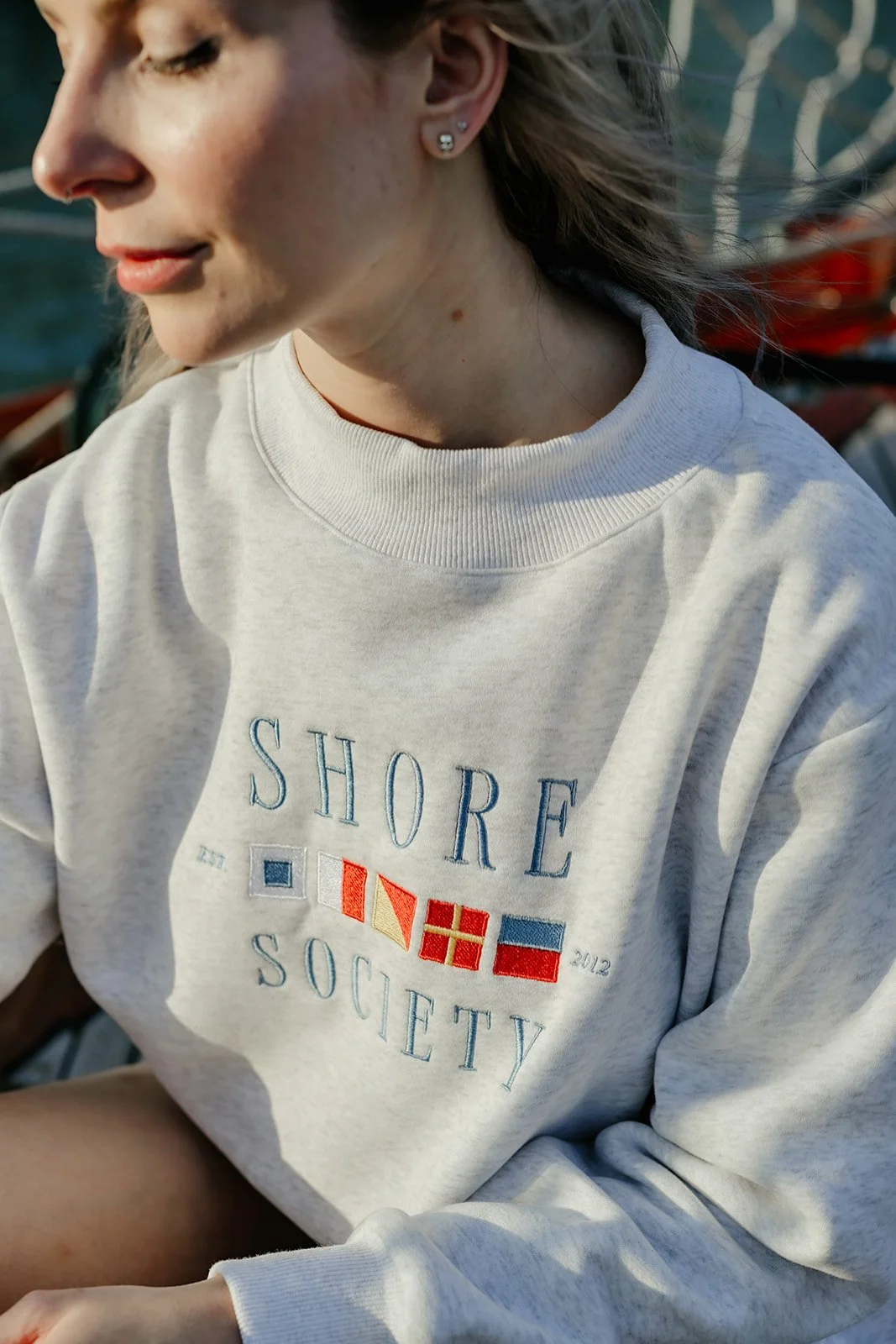 Heather gray Shore Society mockneck sweatshirt with colorful nautical signal flags, a classic preppy coastal sweatshirt
