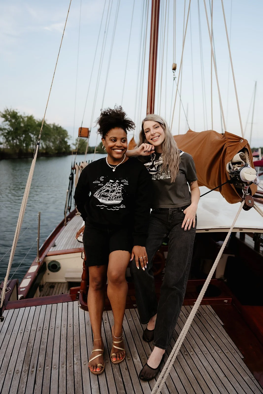 Ghost Ship crewneck sweatshirt in black with white vintage sailing ship, crescent moon, stars and subtle skull graphic.