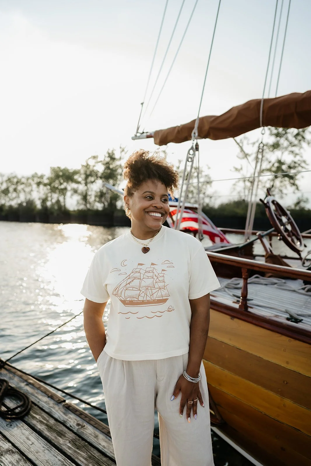 Ivory Ghost Ship graphic tee with vintage sailing ship, crescent moon and skull design, a coastal Halloween t-shirt