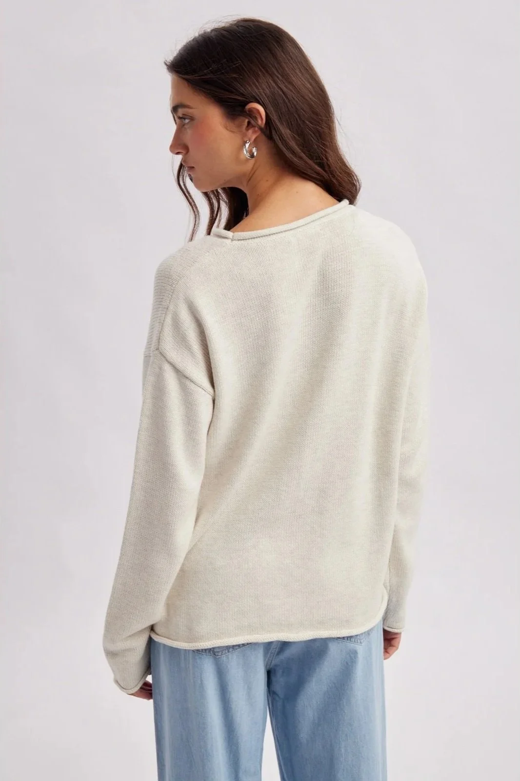 Ivory lighthouse sweater with light blue coastal lighthouse design, a nautical knit.