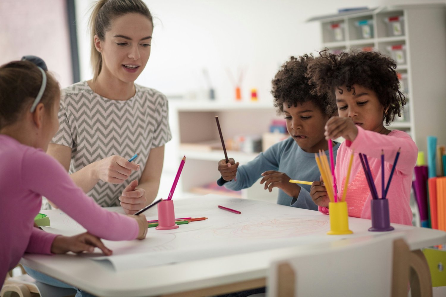 Teacher working with students on assessment