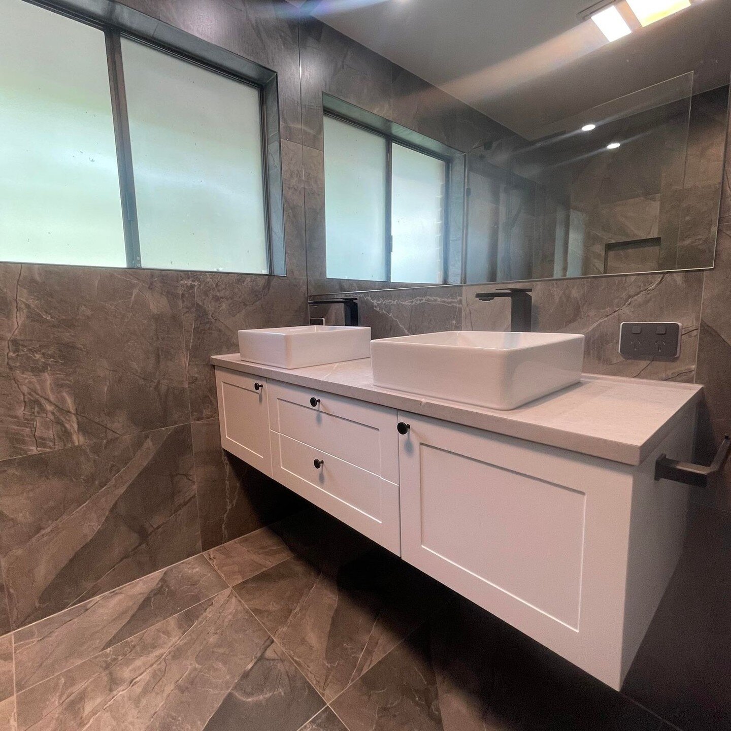 Experience the ultimate in modern luxury with our latest bathroom renovation featuring a sleek wall hung vanity and stunning walk-in shower. This stunning transformation is the perfect example of how Gold Star Bathrooms can help you turn your dream b