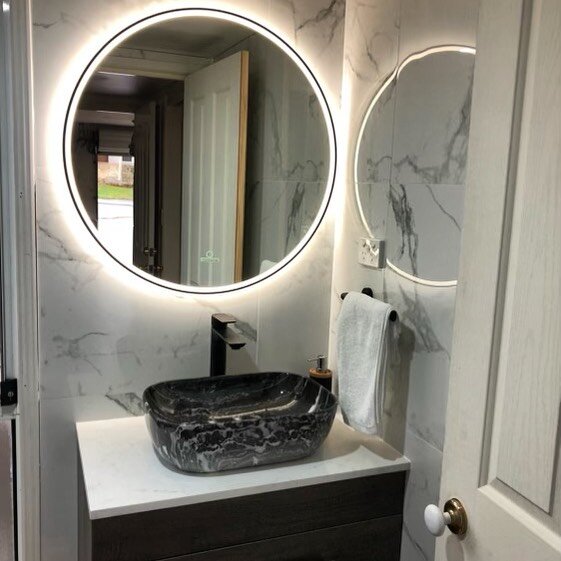 Backlit mirrors have become increasingly popular in modern bathrooms, as they provide a unique and elegant look while also serving a practical purpose. These mirrors are designed with built-in LED lights that are mounted behind the mirror, providing 