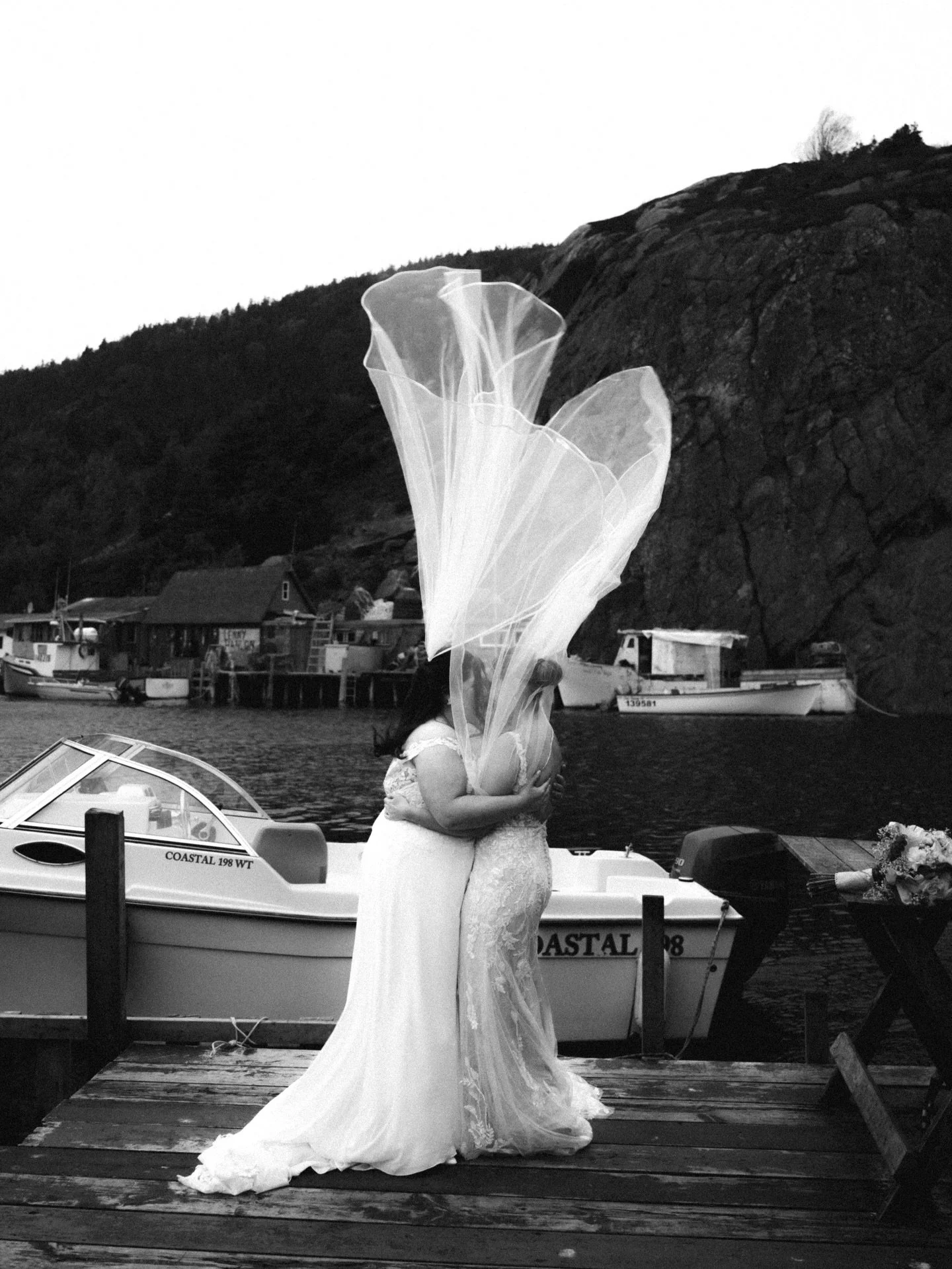 Julia &amp; Megan 🤍

Proof that a little Newfoundland wind only adds to the romance. Raw, real, windswept love on the wharf.
