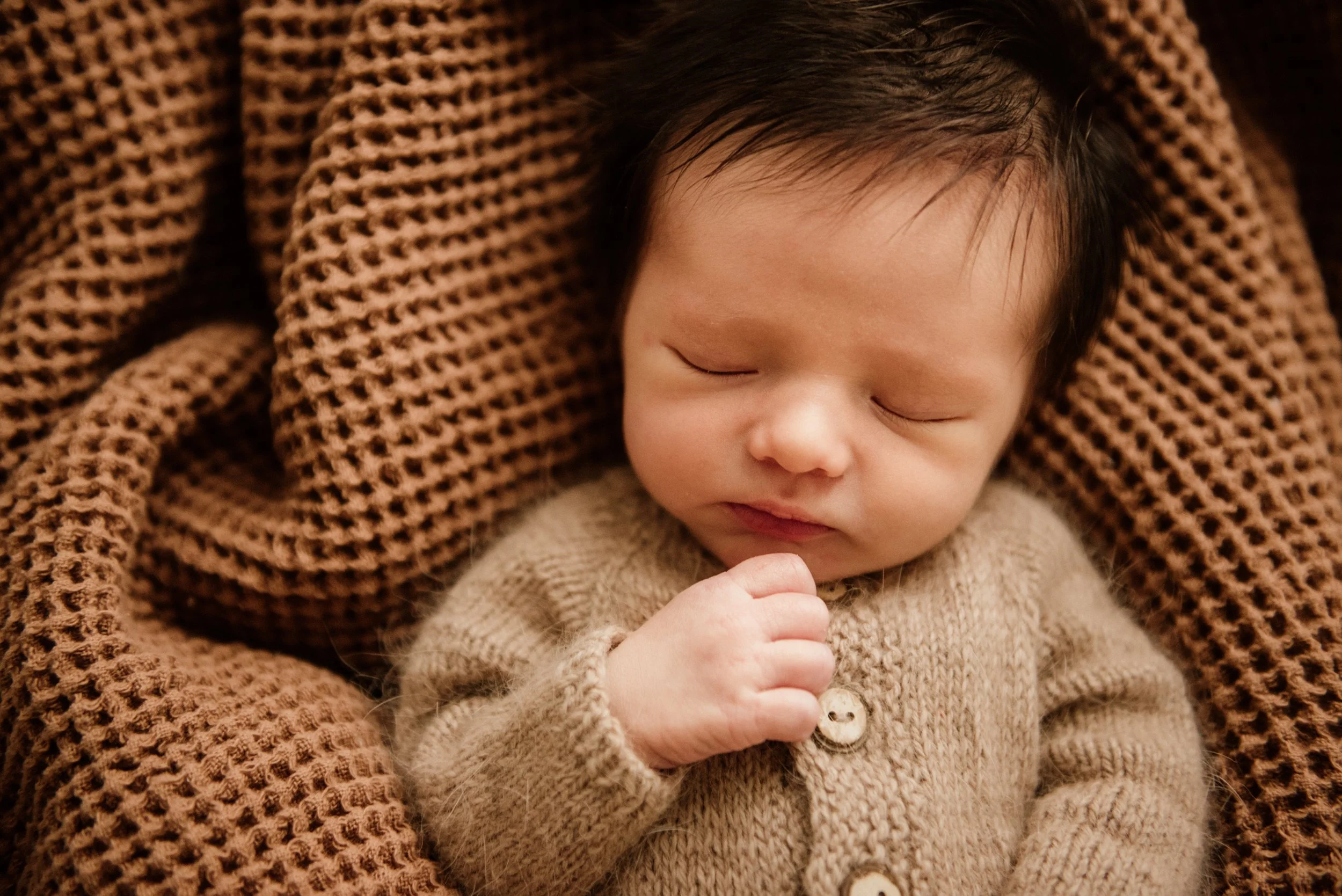 newborn baby with hair sleeping in cleveland ohio