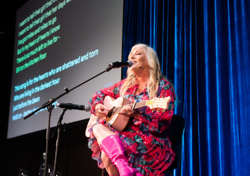 Julia Grace singing on stage