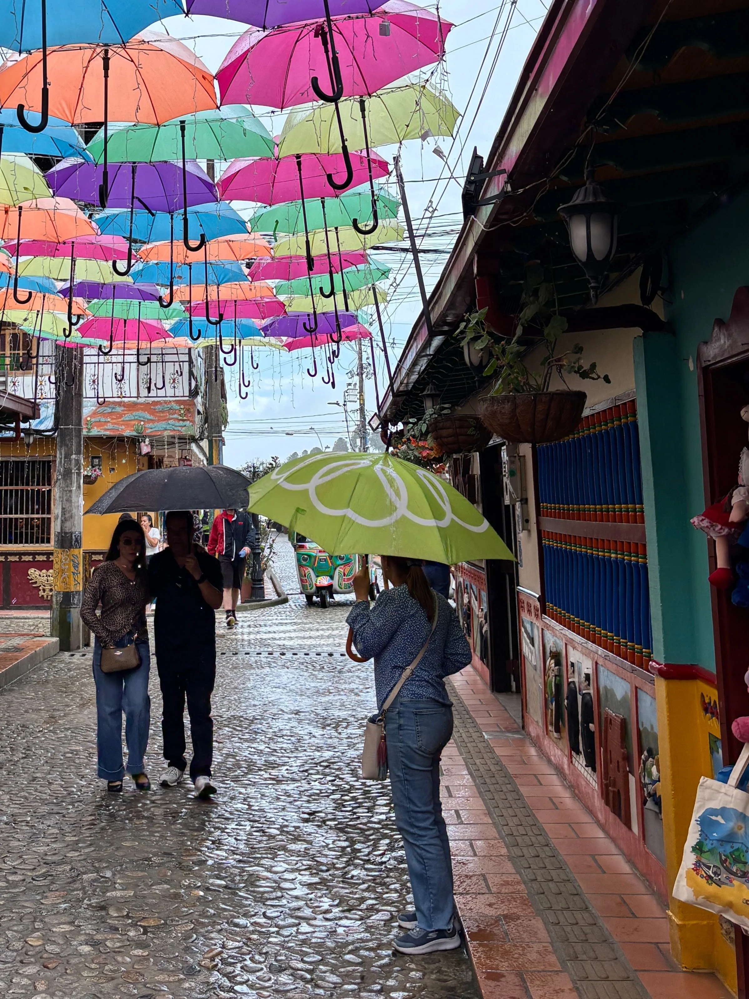 People in the rain, under an umbrella decoration