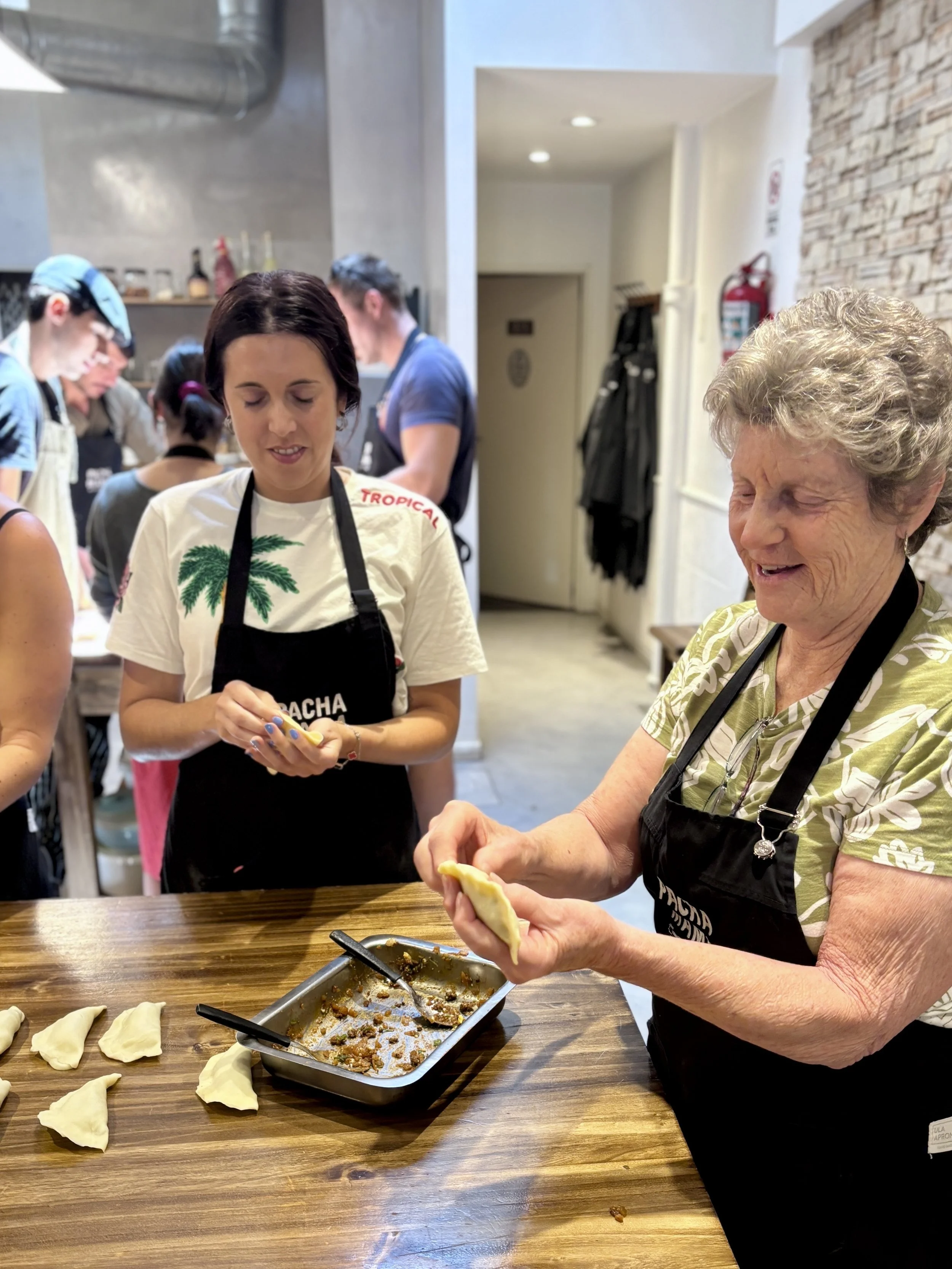 Women making empanadas