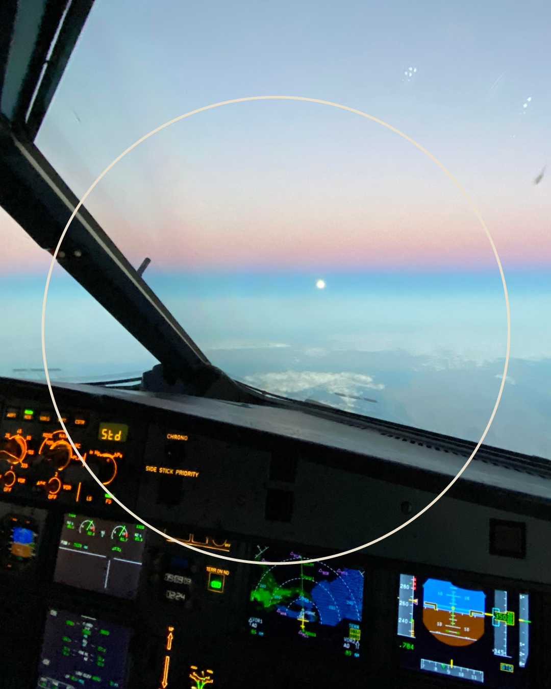 Sunrise view from an airline cockpit, representing pilots relocating between bases and travel for work.